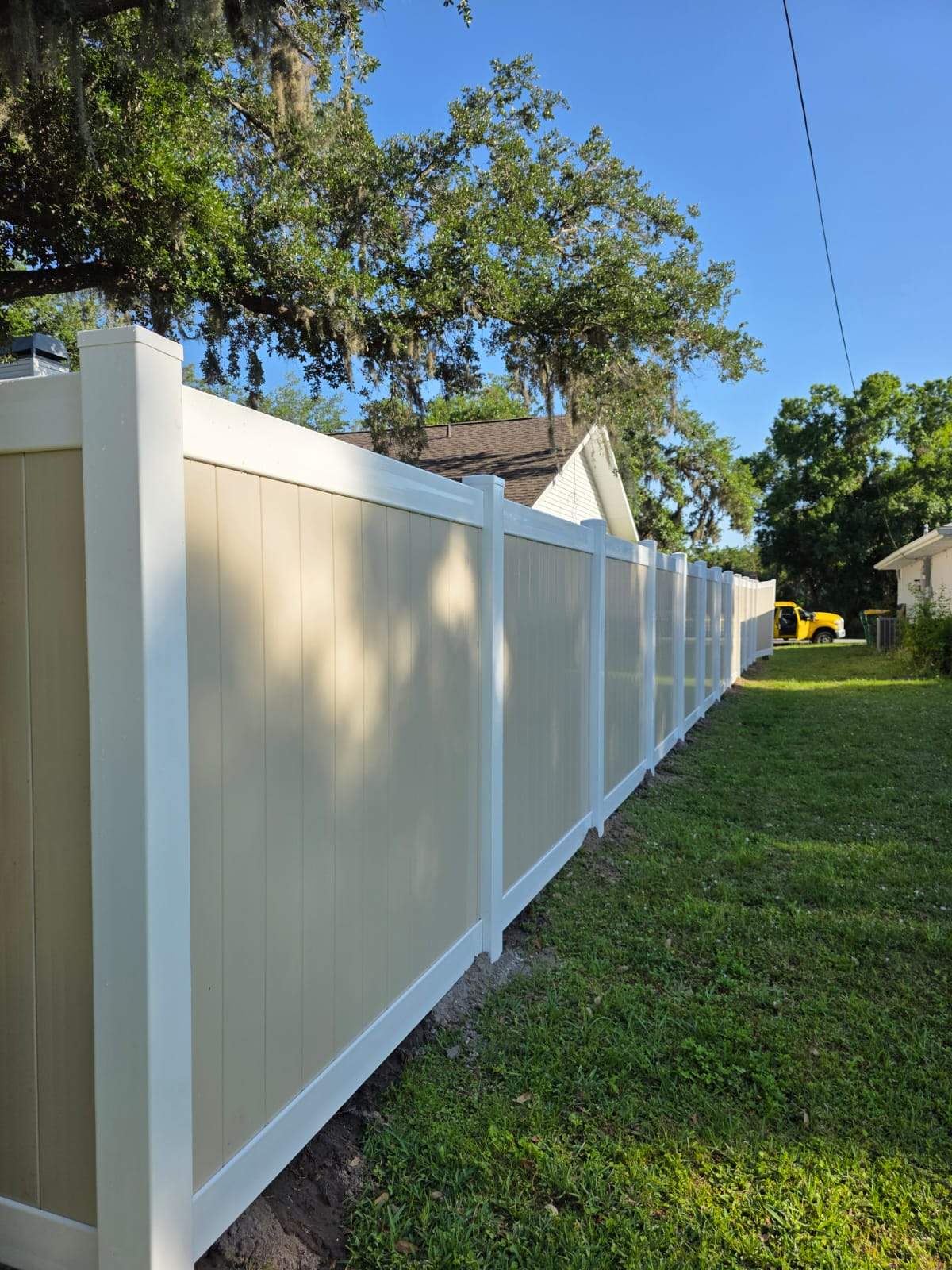 Two-Tone Vinyl Privacy Fence Installation in Port Charlotte by True Fence LLC