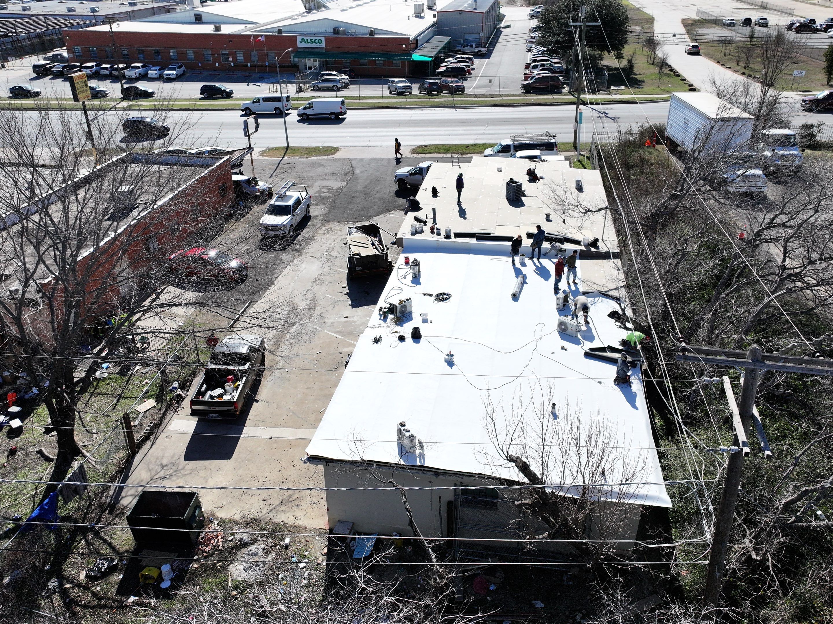 Commercial roofing overlay using GAF TPO over an old ballast roof by Becker Roofing and Exteriors