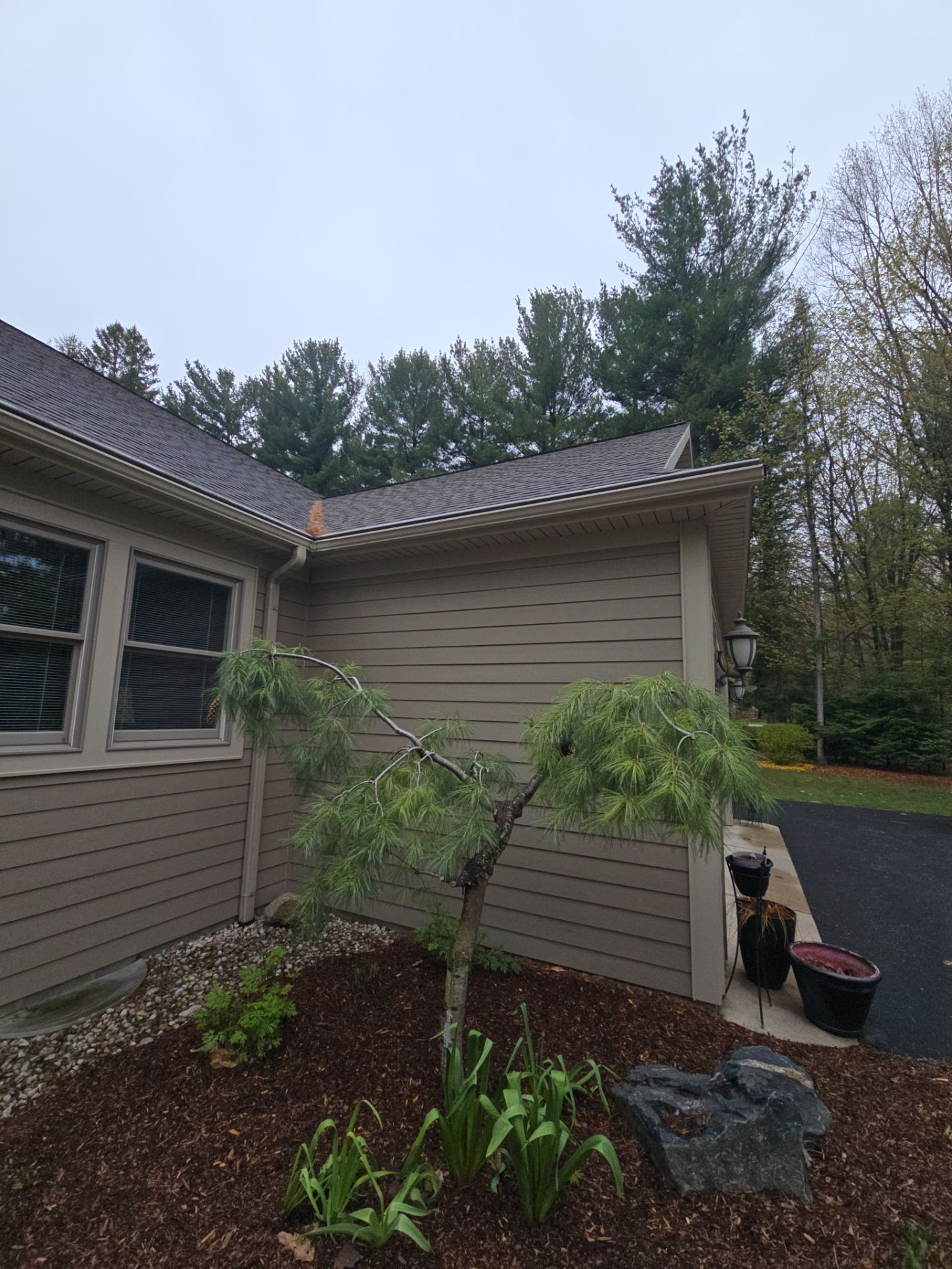 Gutter Helmet Installation on a Multi-Level Traverse City Residence by Rainbow Seamless Systems