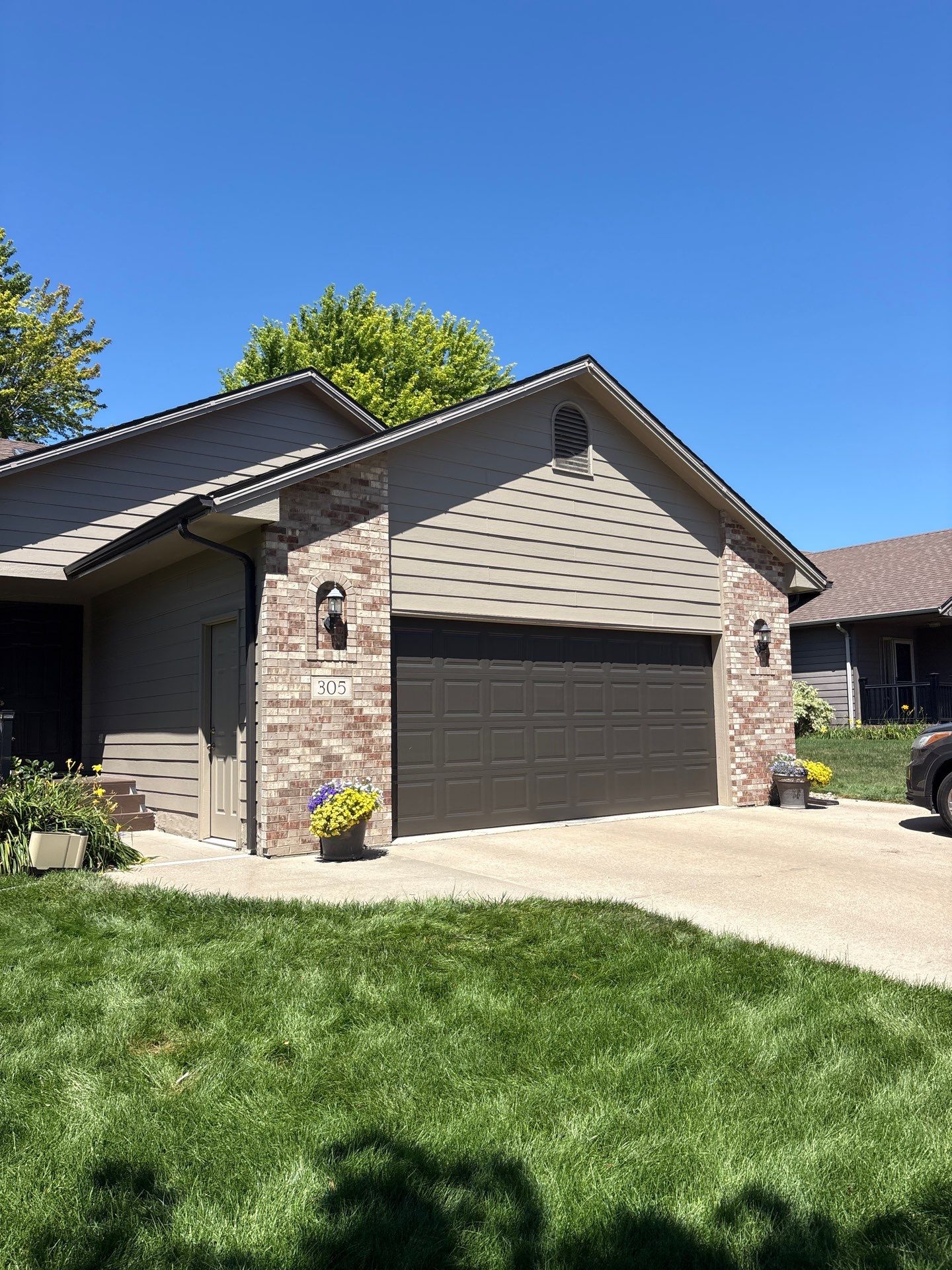 Residential Exterior Painting and Trim Restoration in Sioux Falls by Select Painting, Coatings & Garage Cabinets