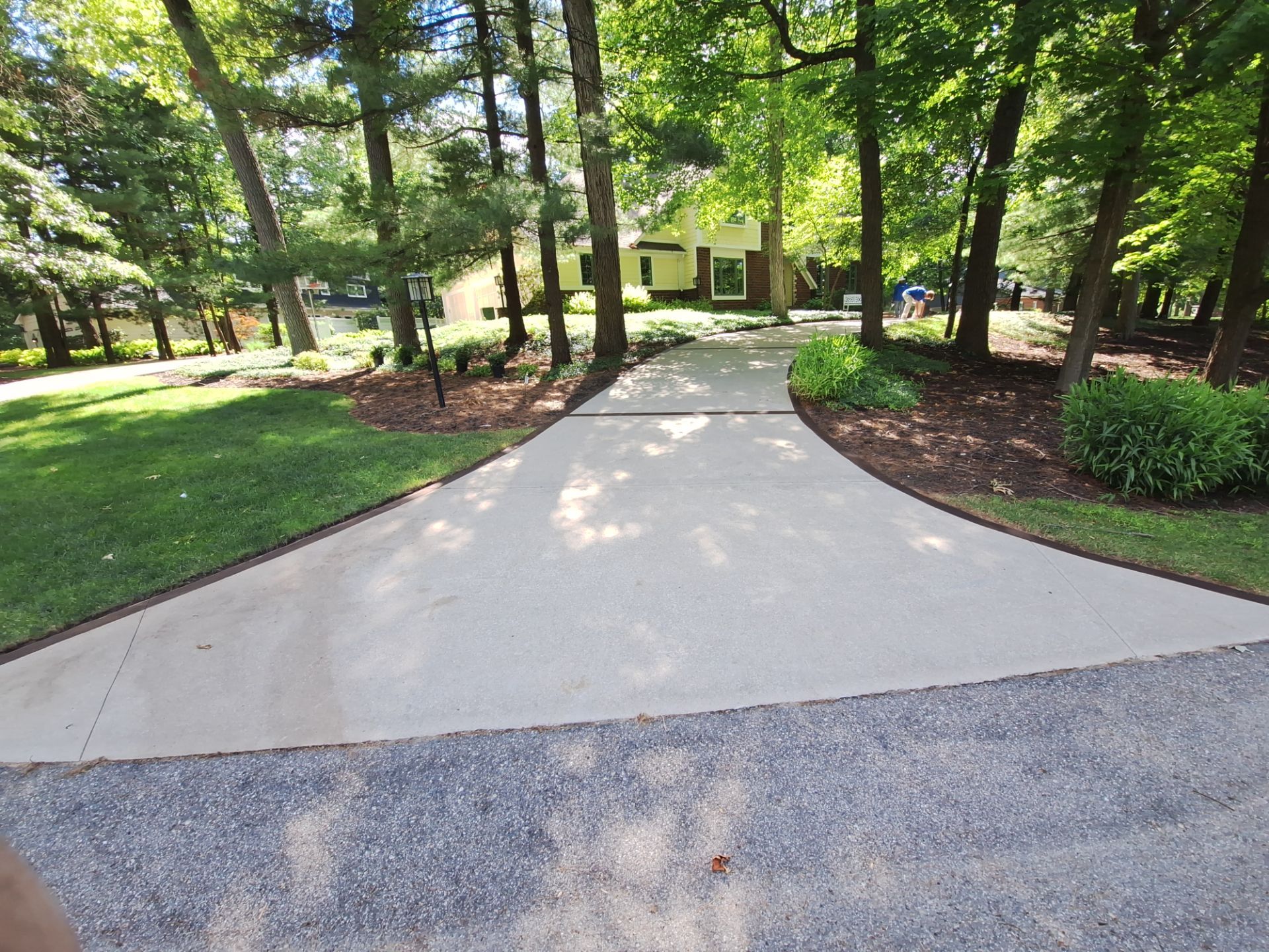 Concrete Driveway and Walkway Staining With Espresso Borders in Grand Rapids by Gordon Painting