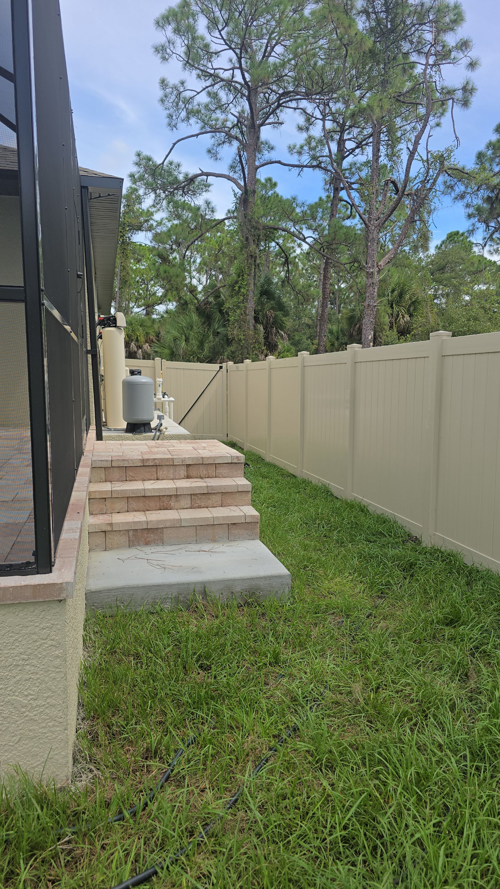 Tan Vinyl Privacy Fence and Gate Installation in Port Charlotte by True Fence LLC