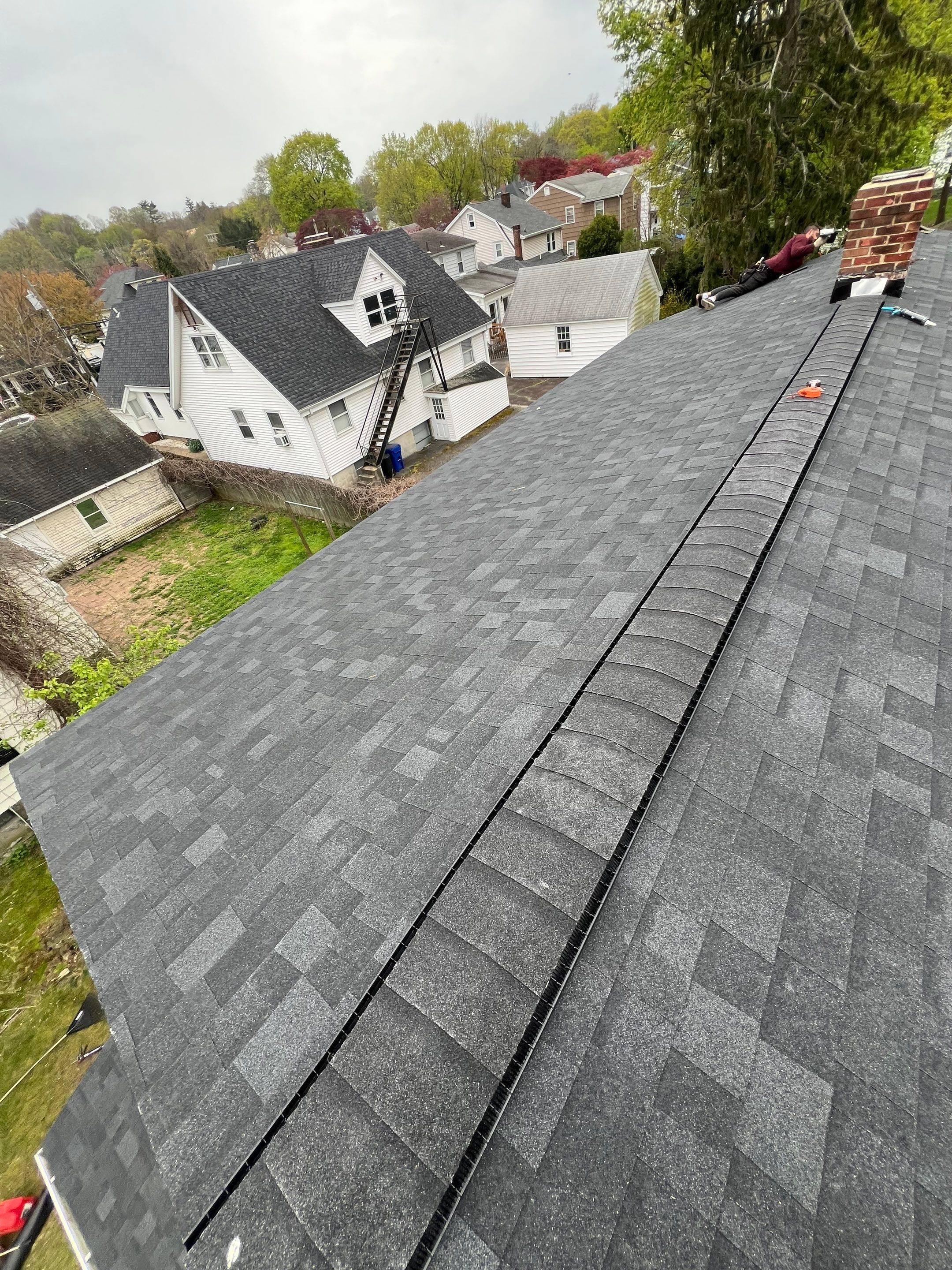 Charcoal Shingles by Reimagine Roofing