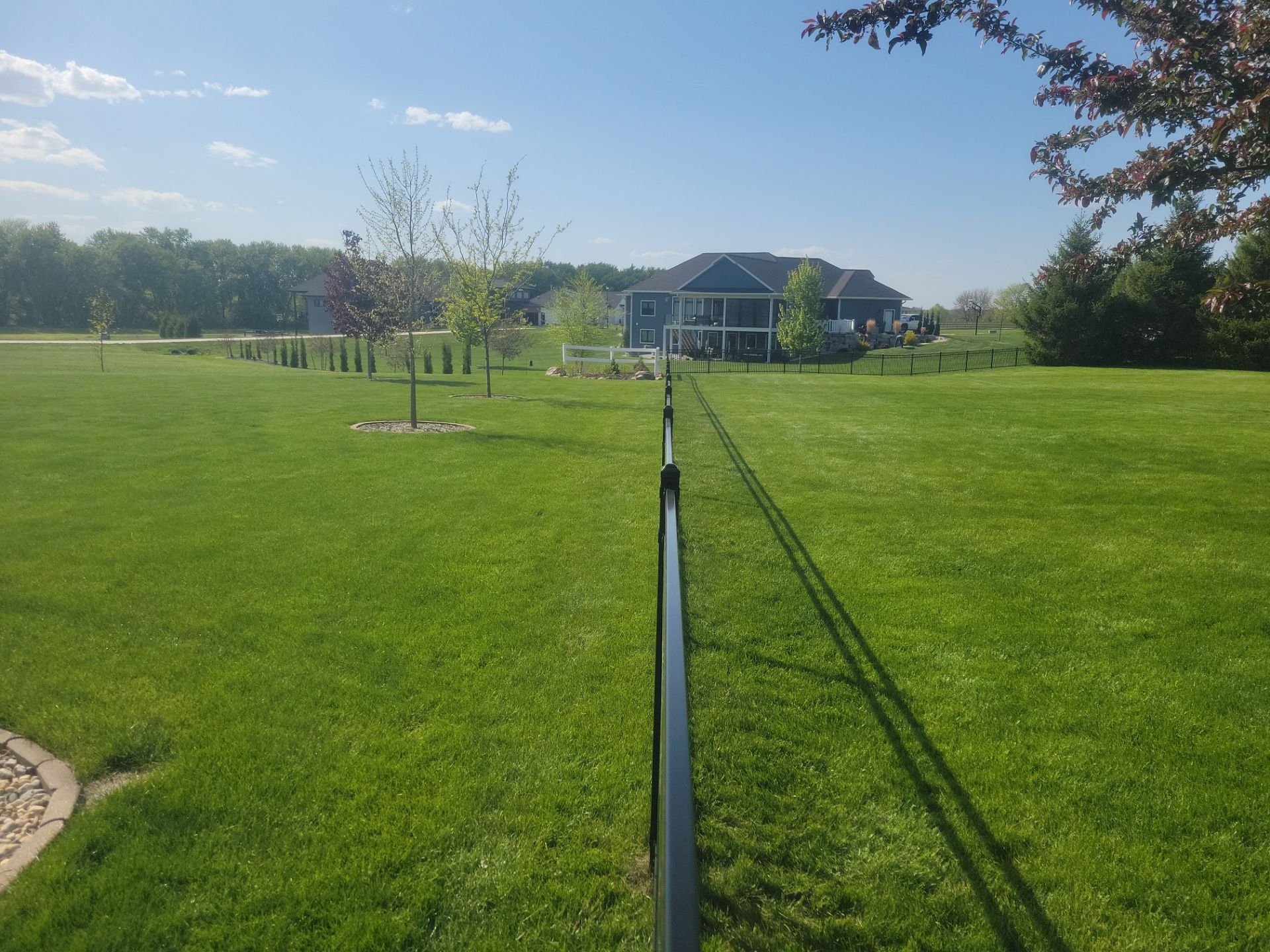 Black Ornamental Metal Picket Fence Installation in Waterloo by Perfect Picket Fence and Stain