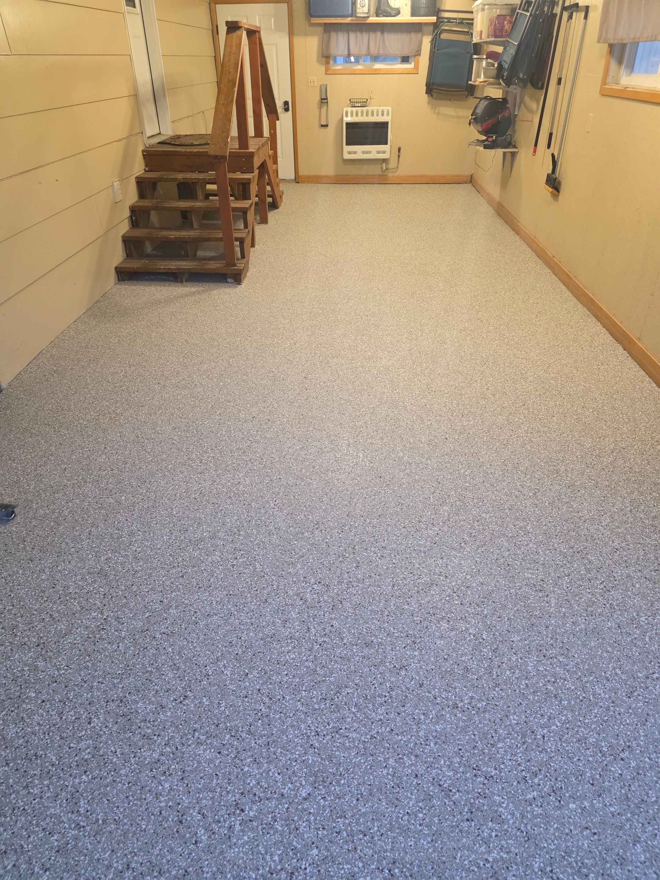 Full Garage and Basement Epoxy Floor Coating in Winner by Select Painting, Coatings & Garage Cabinets