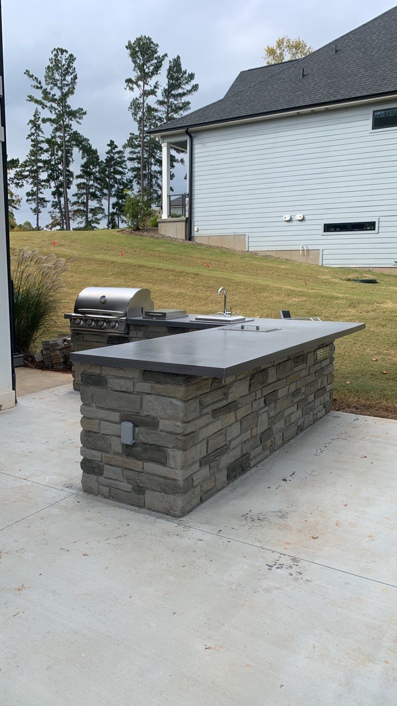Outdoor Kitchen on Lake Keowee by Xtreme Concrete Services