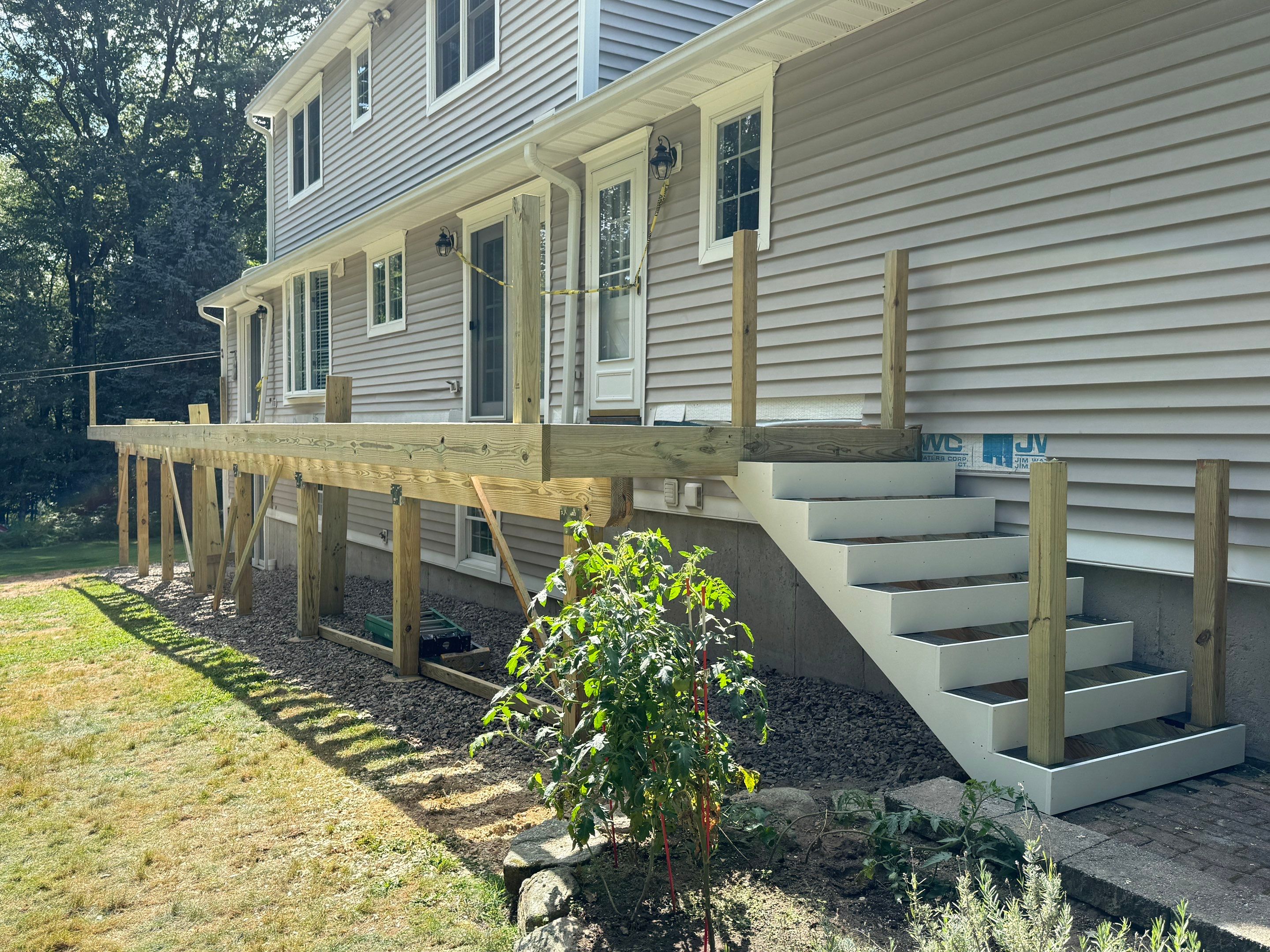 Replacement of front and back decks using Trex Lineage Island mist and Trex Lineage Rainier by DiGiorgi Roofing and Siding Inc