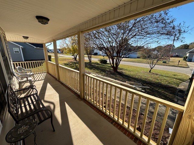 Custom Screened Porch Conversion with New Wood Railing in Dunn by The Remodeling Company