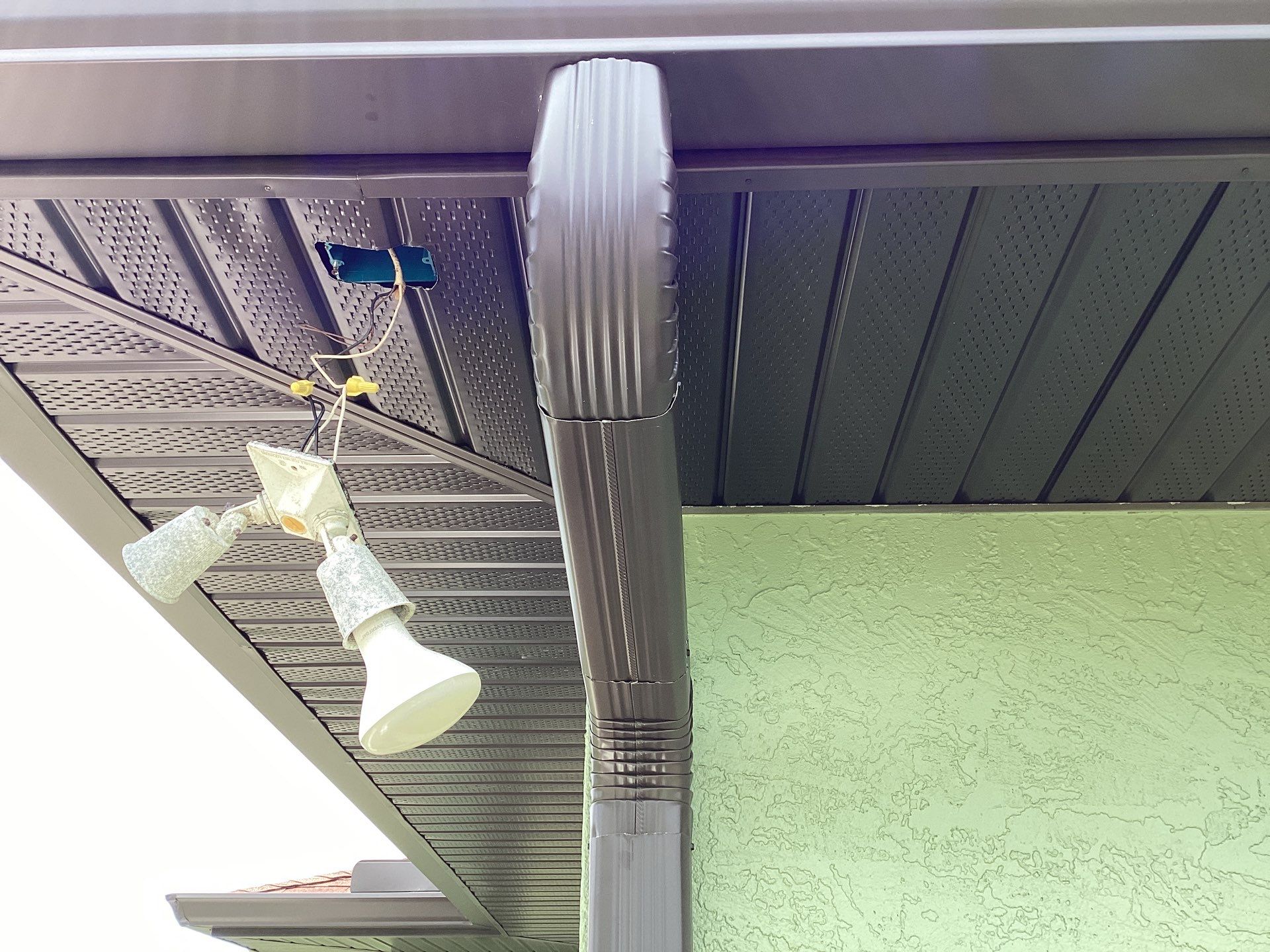 Musket brown downspouts with 6-inch K-Style gutter installation in Myakka City, FL by Gutter Professors