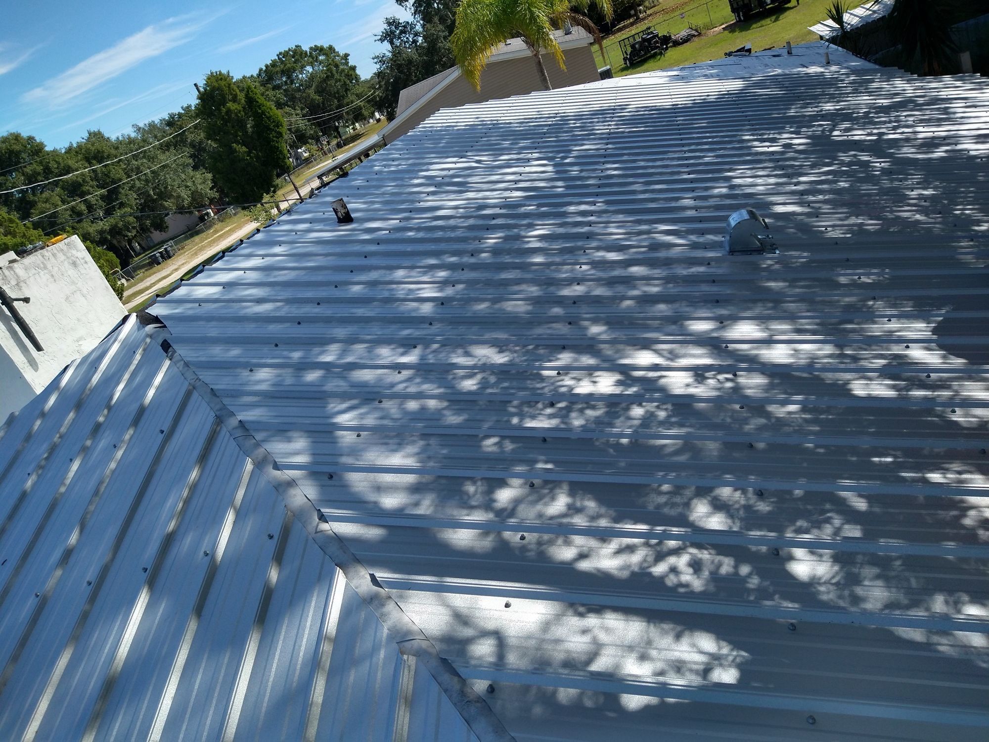 Residential Roofing Installation using 26 GA Rib Panel Galvalume by 1st Class Roofing, Inc.