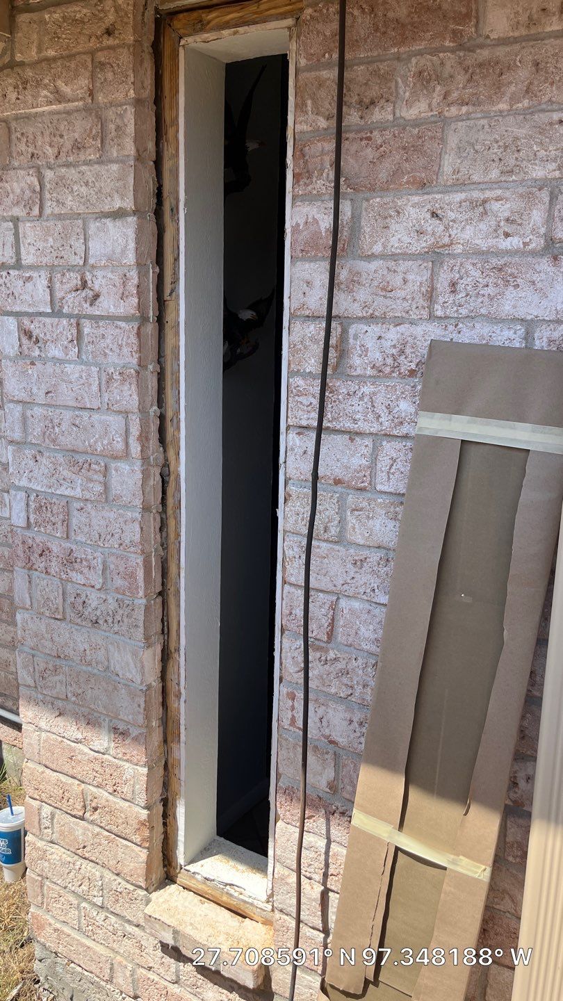 Colored Vinyl Windows to blend into brick by Bayfront Roofing and Construction