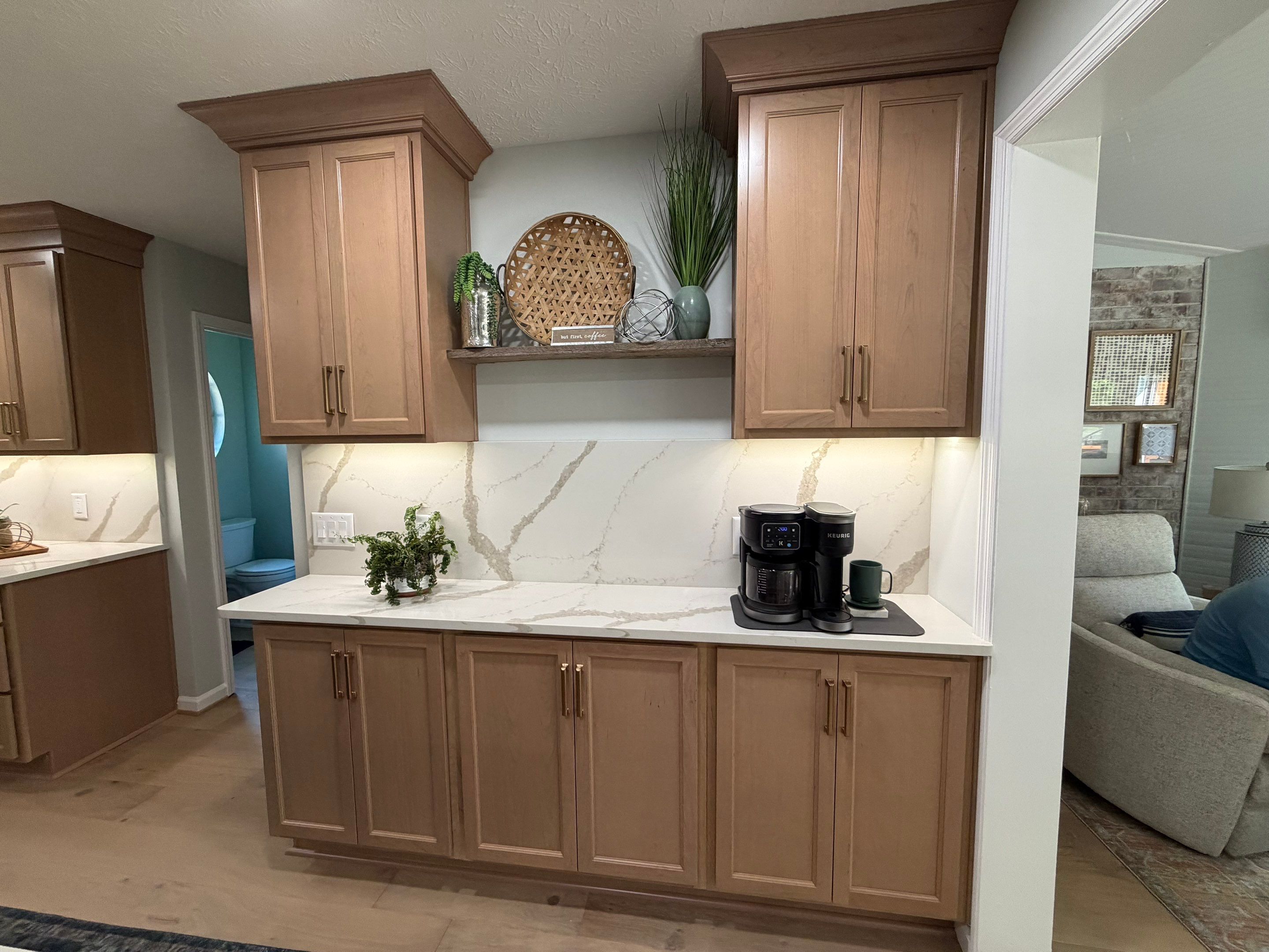 Modern Kitchen Remodel Featuring Quartz Backsplash, under cabinet lighintg, and a coffee bar in Mt. Juliet Tennessee by DeRo Renovations,LLC
