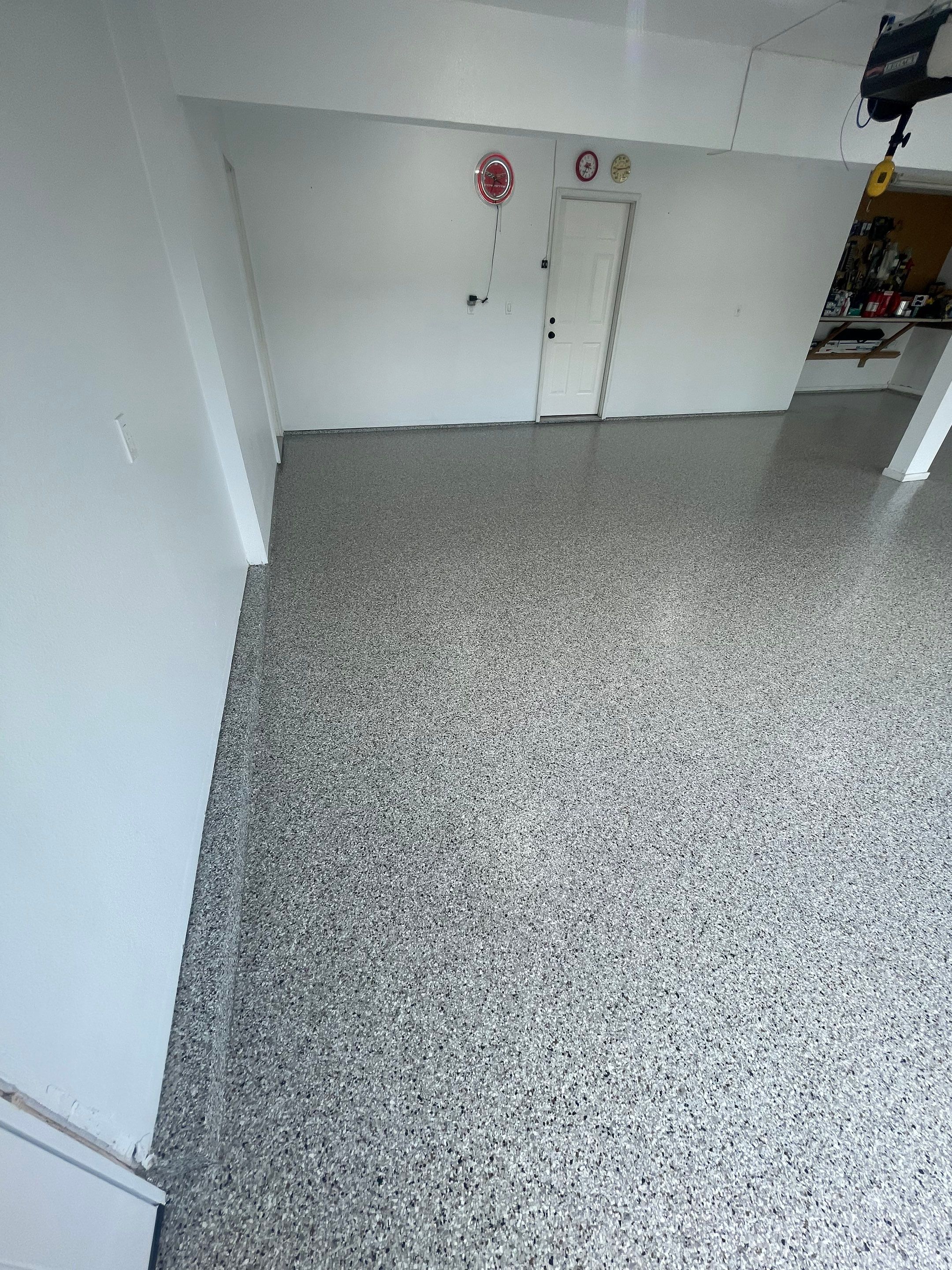 Multi-Car Garage Concrete Coating with Coyote Flake Finish in Sioux Falls by Select Painting, Coatings & Garage Cabinets