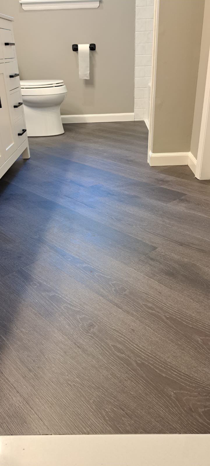 Bathroom Remodel using LVP Flooring by Home Concepts Construction