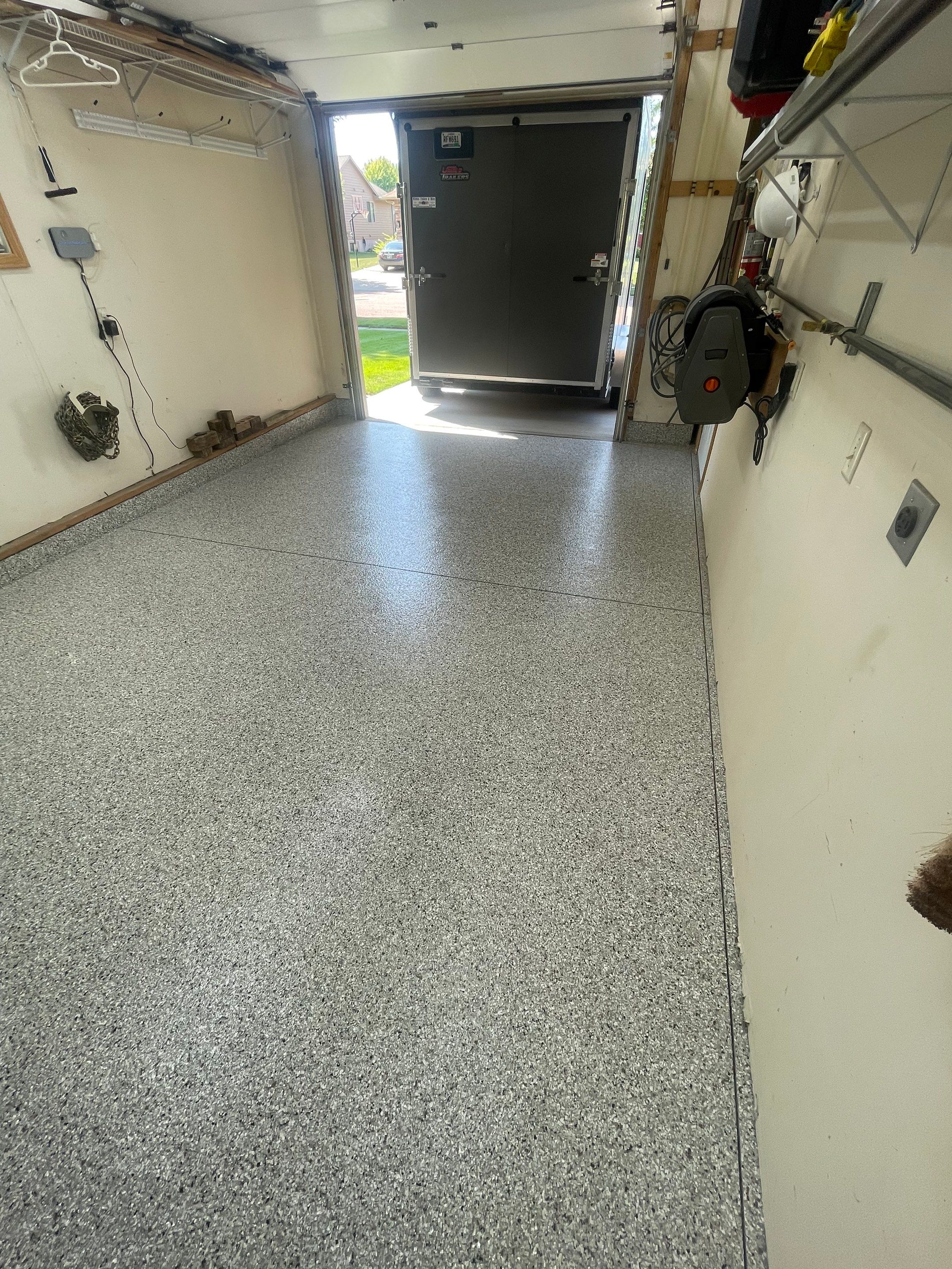 Multi-Stall Garage Floor Coating Installation in Sioux Falls by Select Painting, Coatings & Garage Cabinets