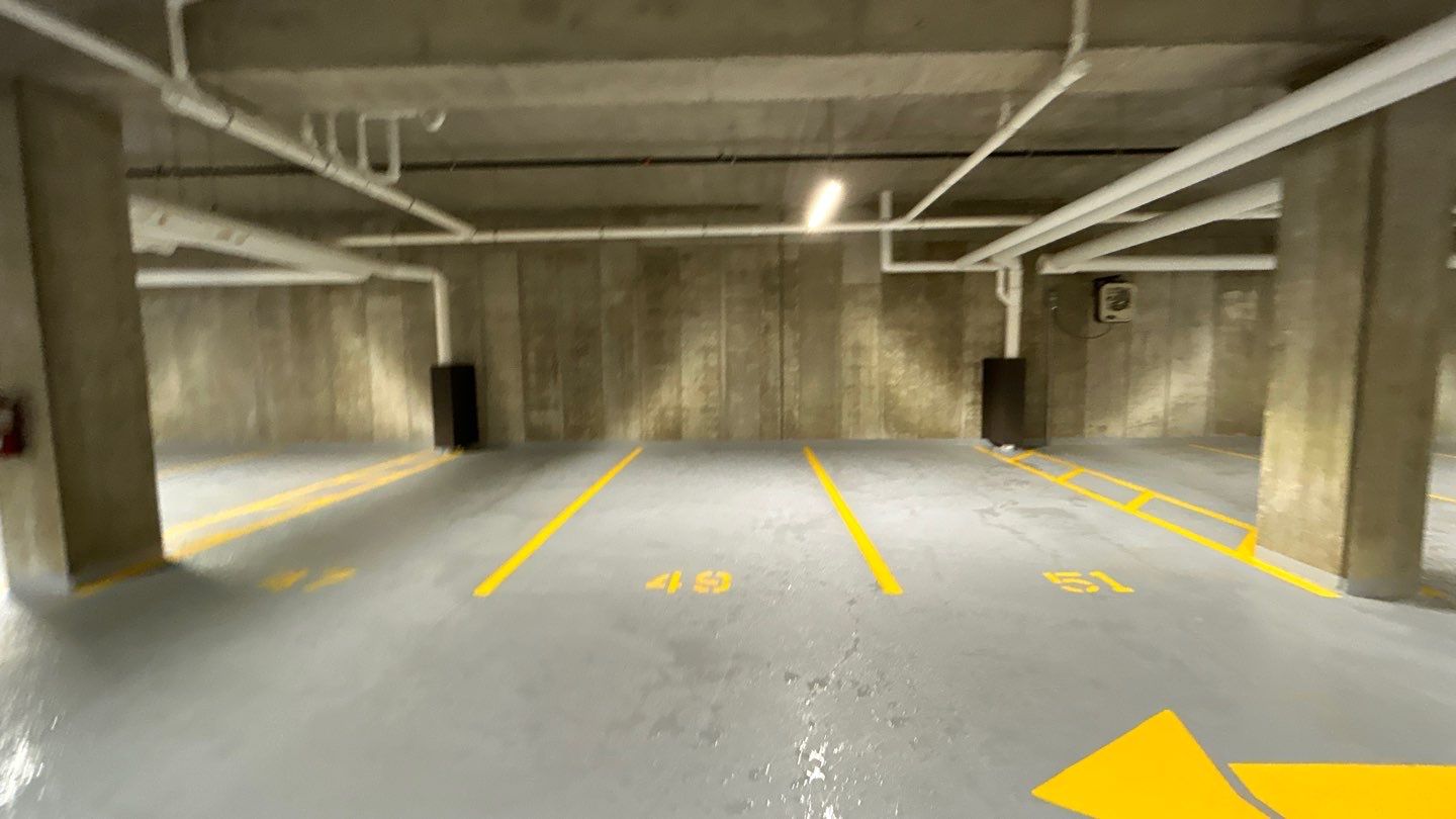 Parking garage using Hot water by Northern Power Washing LLC.