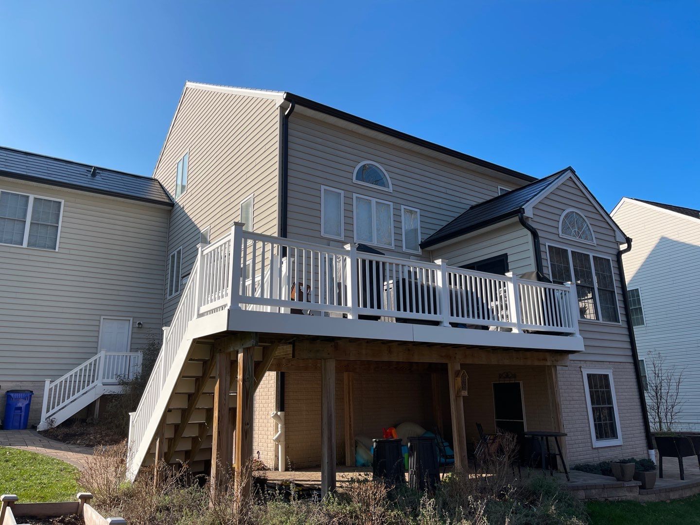 Tesla Solar Roof and Gutter Installation by American Home Contractors