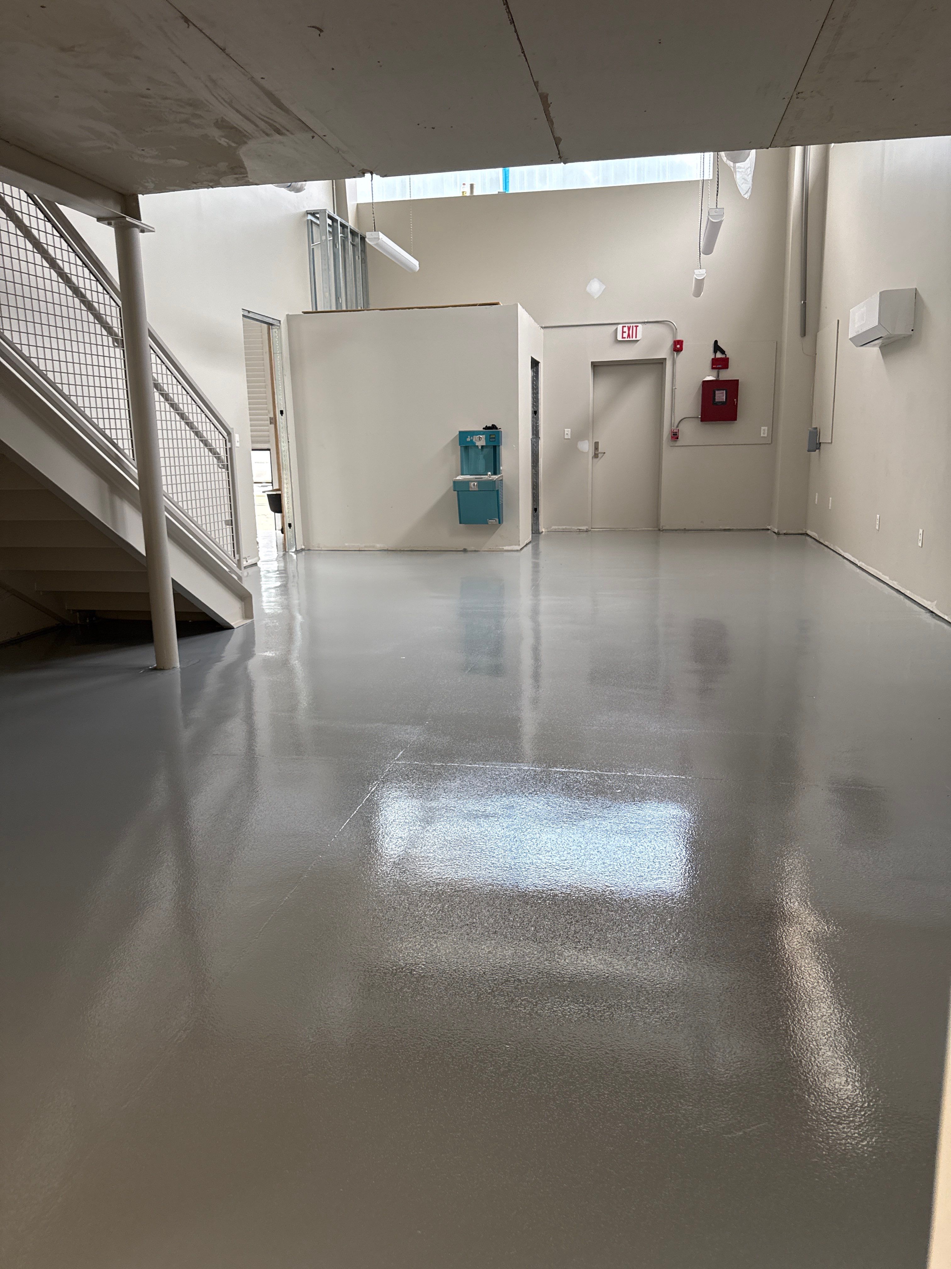 Industrial Epoxy Flooring for Sandhill Crane Workshop in Gautier by Cornerstone Hard Surface Restoration 