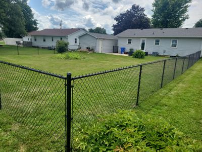 Residential Black Vinyl-Coated Chain Link Fence Installation in Allison