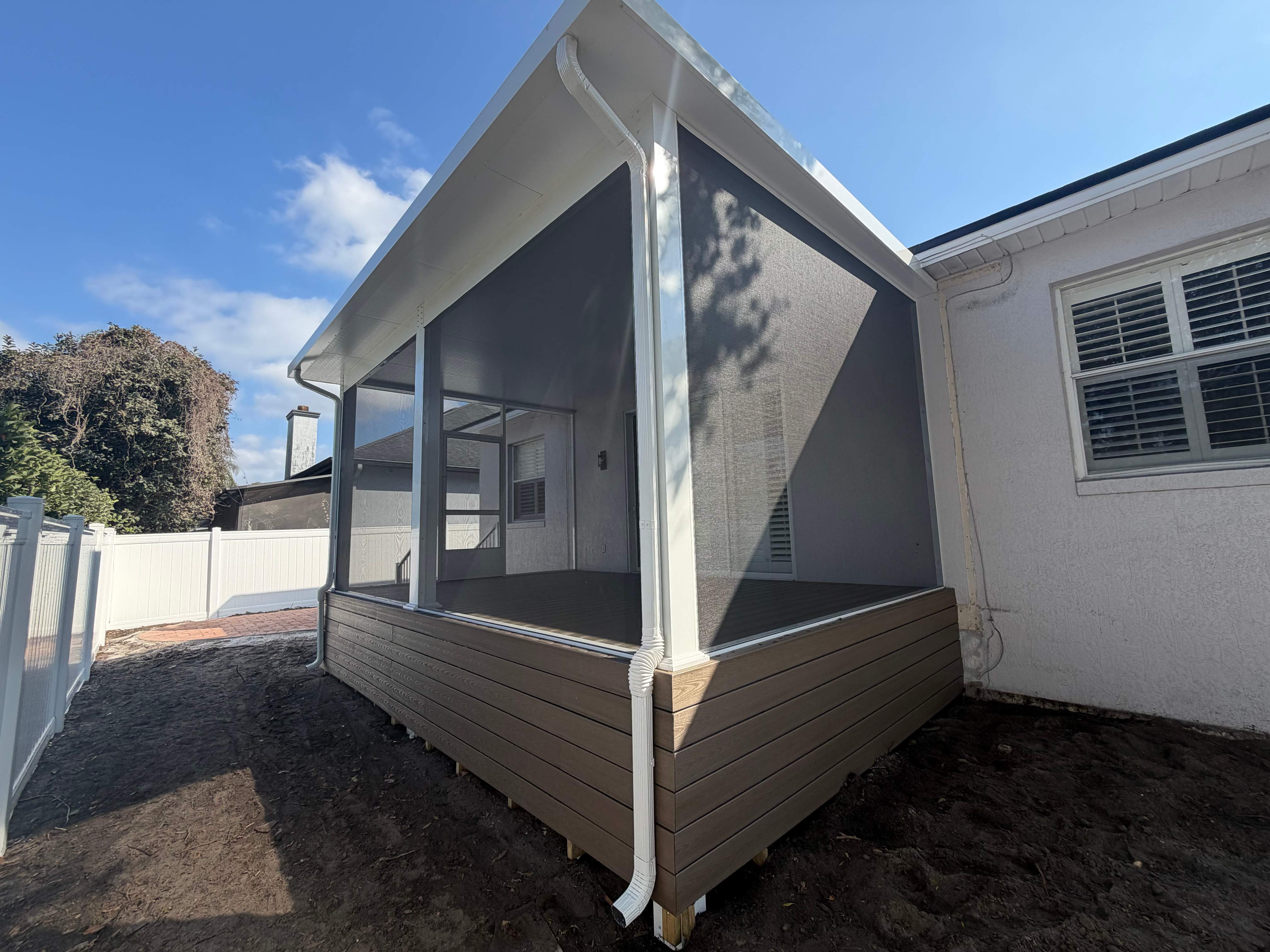 The Complete Backyard Retreat: Insulated Screen Room & Composite Deck by Orlando pergolas