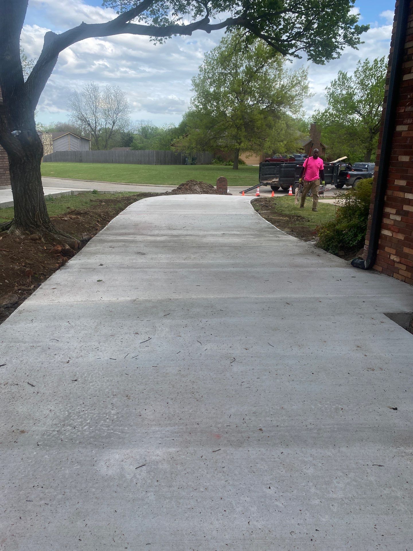 Concrete Driveway and Fence by Clays Services Inc