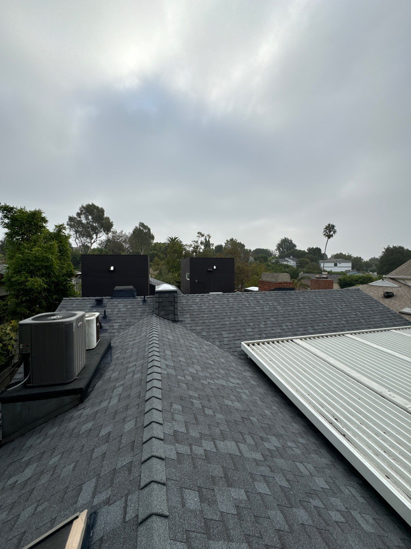 Residential Roofing Installation using Shingles and Silicone by Hull Brothers Roofing
