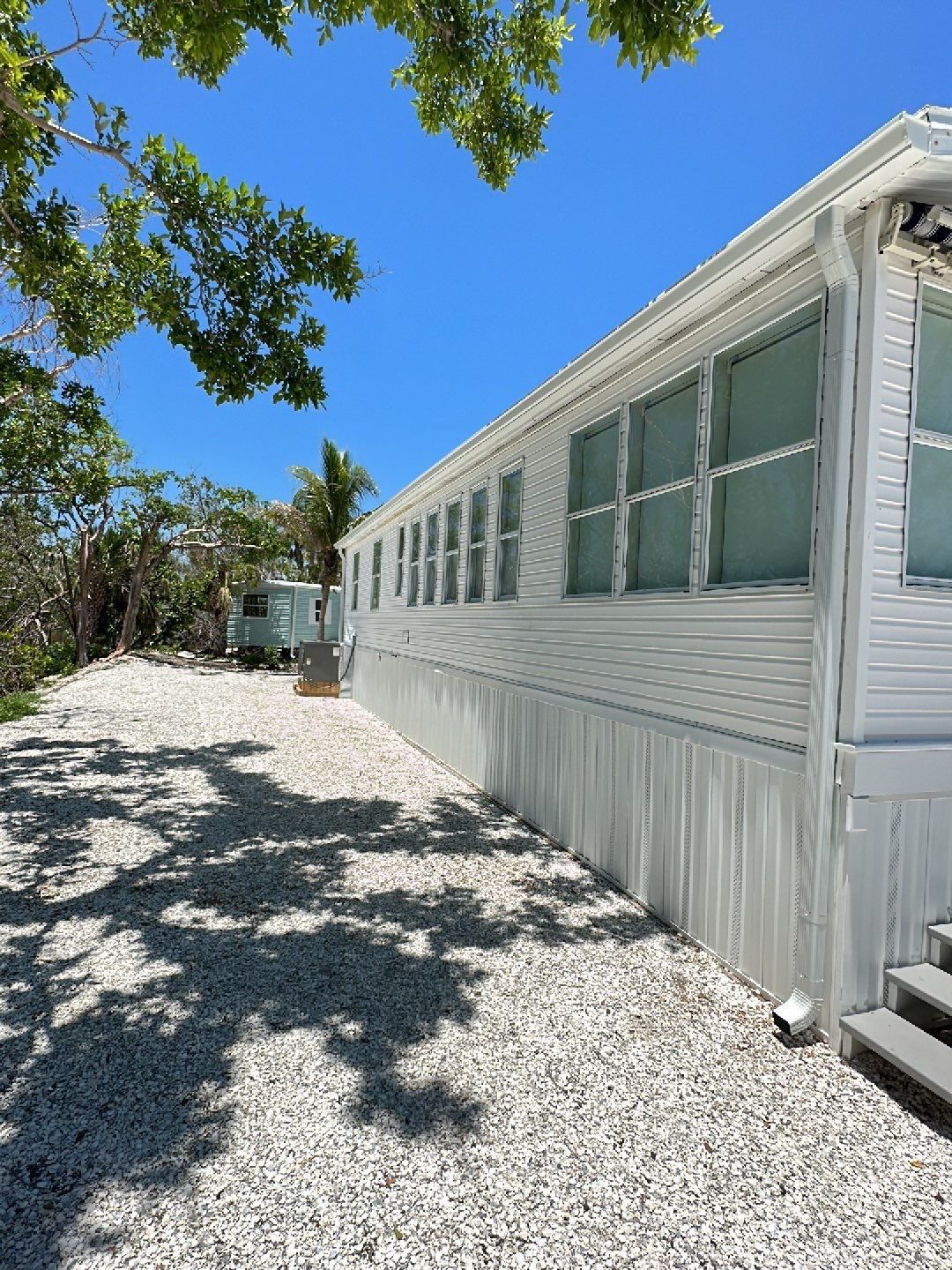 Downspout Installation using Charcoal Grey in Sanibel FL by Gutter Professors