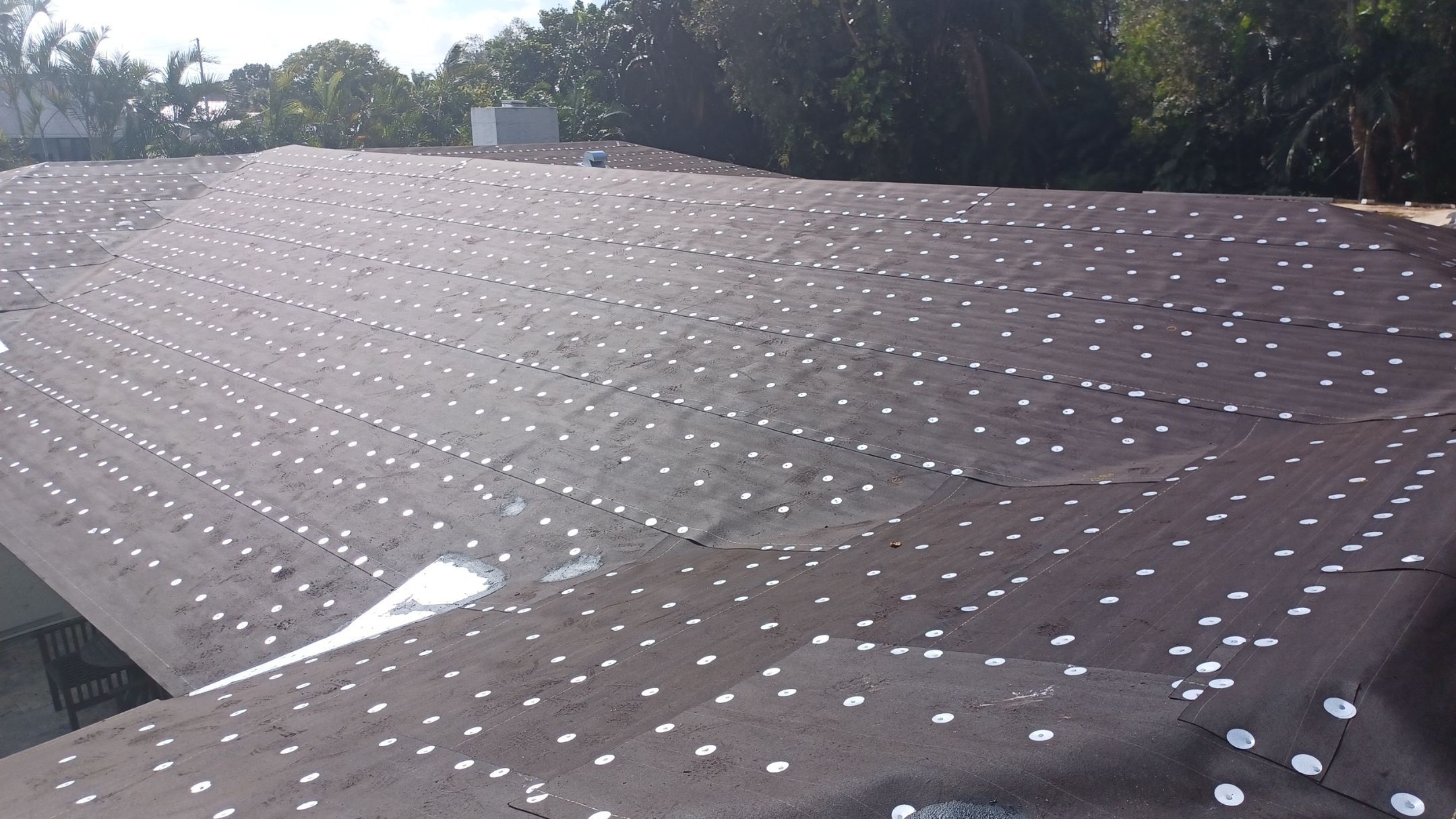 Residential Roofing Installation using 1" Nail strip metal roof by BLUES BROTHERS CONSTRUCTION CORP