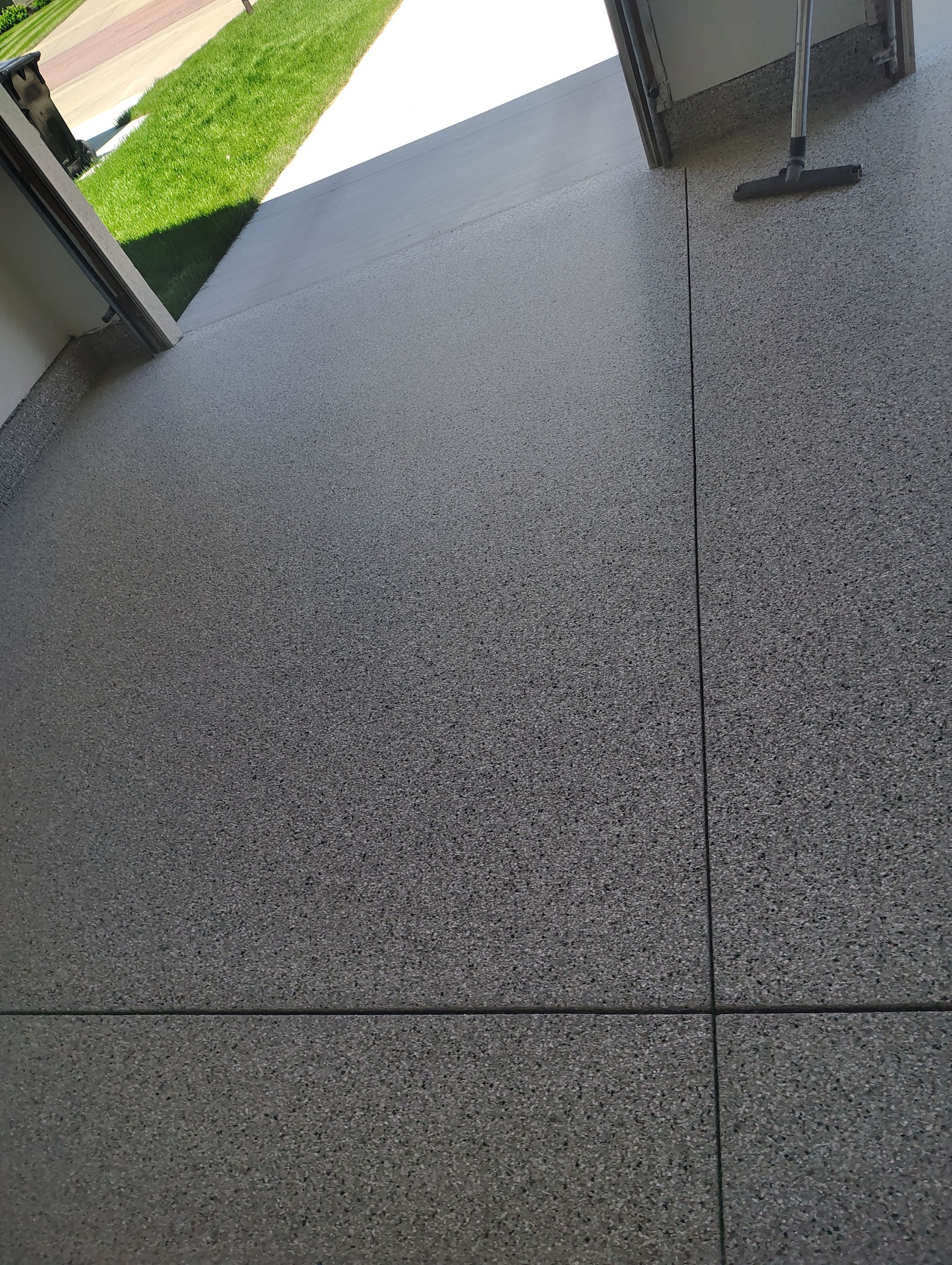 Custom Grey Speckled Epoxy Floor Coating for Sioux Falls Garage by Select Painting, Coatings & Garage Cabinets