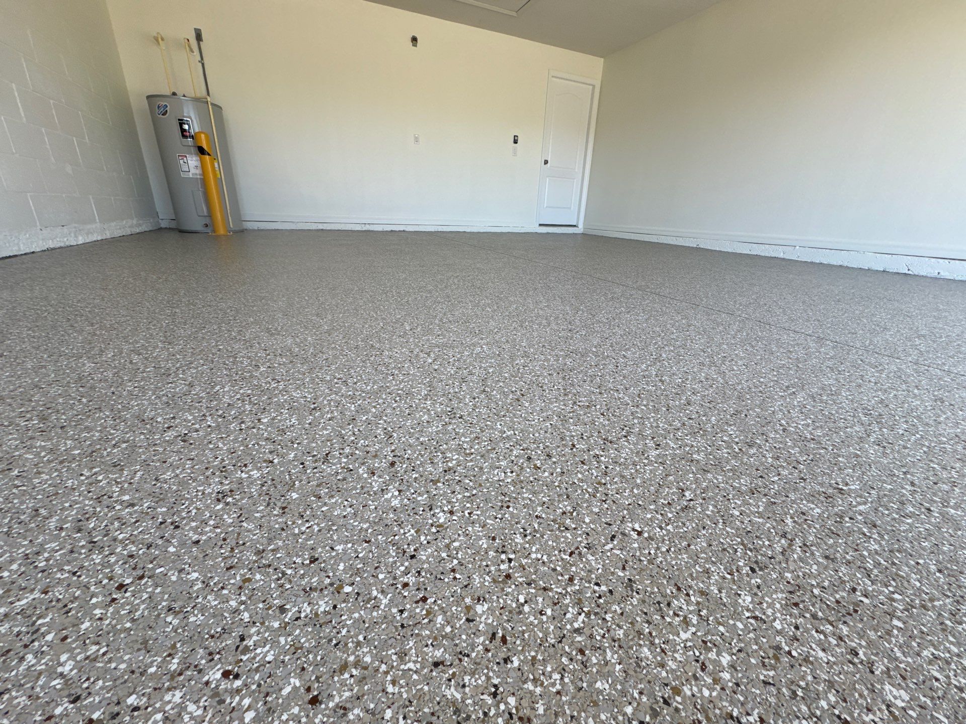 Clean & Practical 'Creekbed' Flake Finish by Performance Floors & Coating