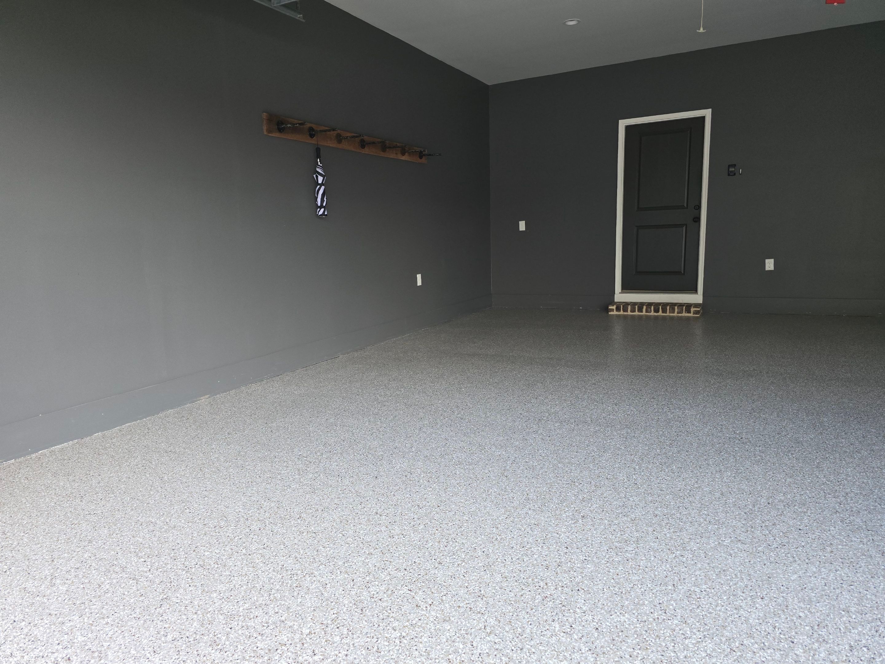 Garage & Porch Using Creekbed & Shoreline by Elite Floor Solutions