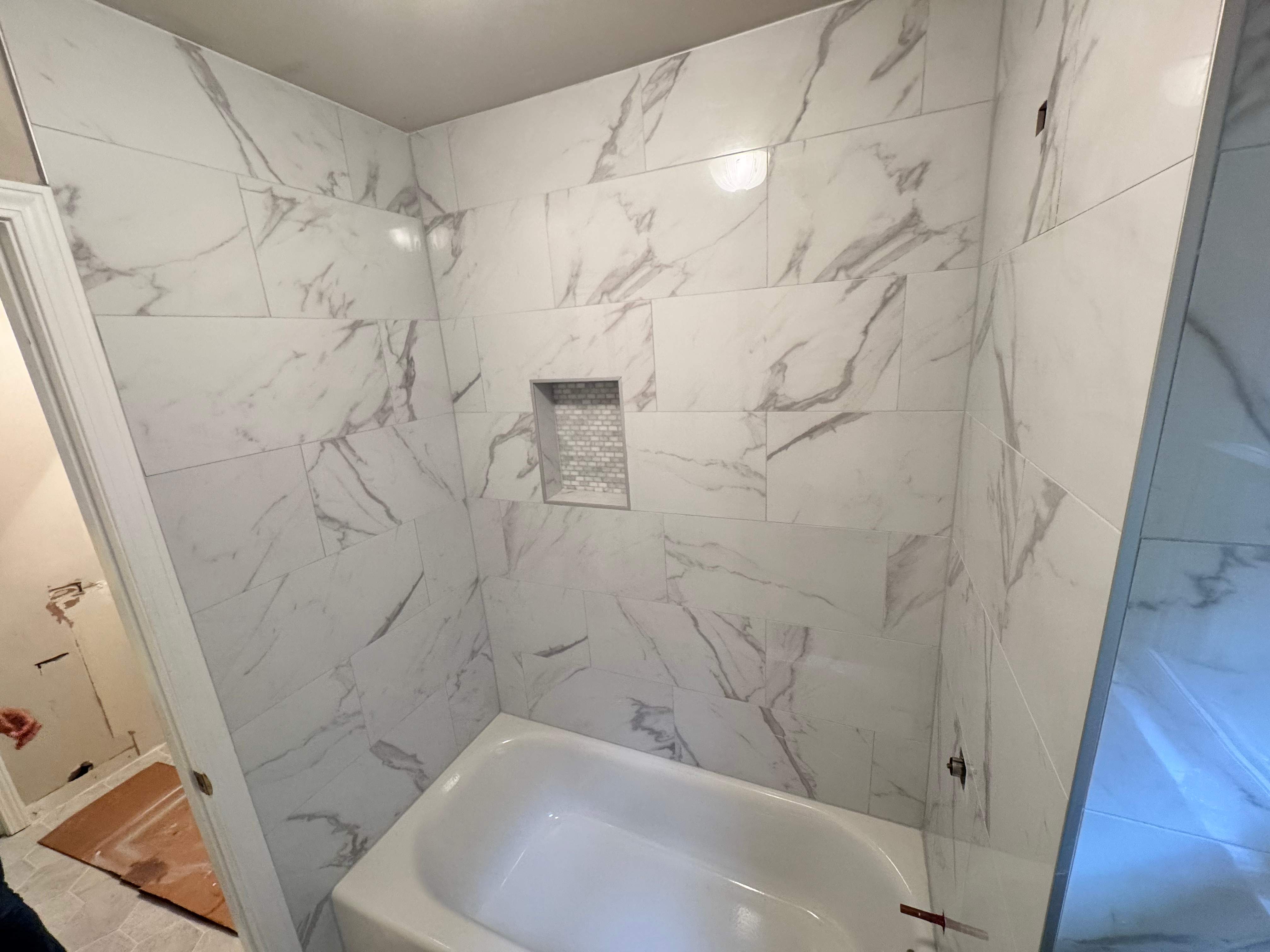 Tub and floor tile installation by Prudencio