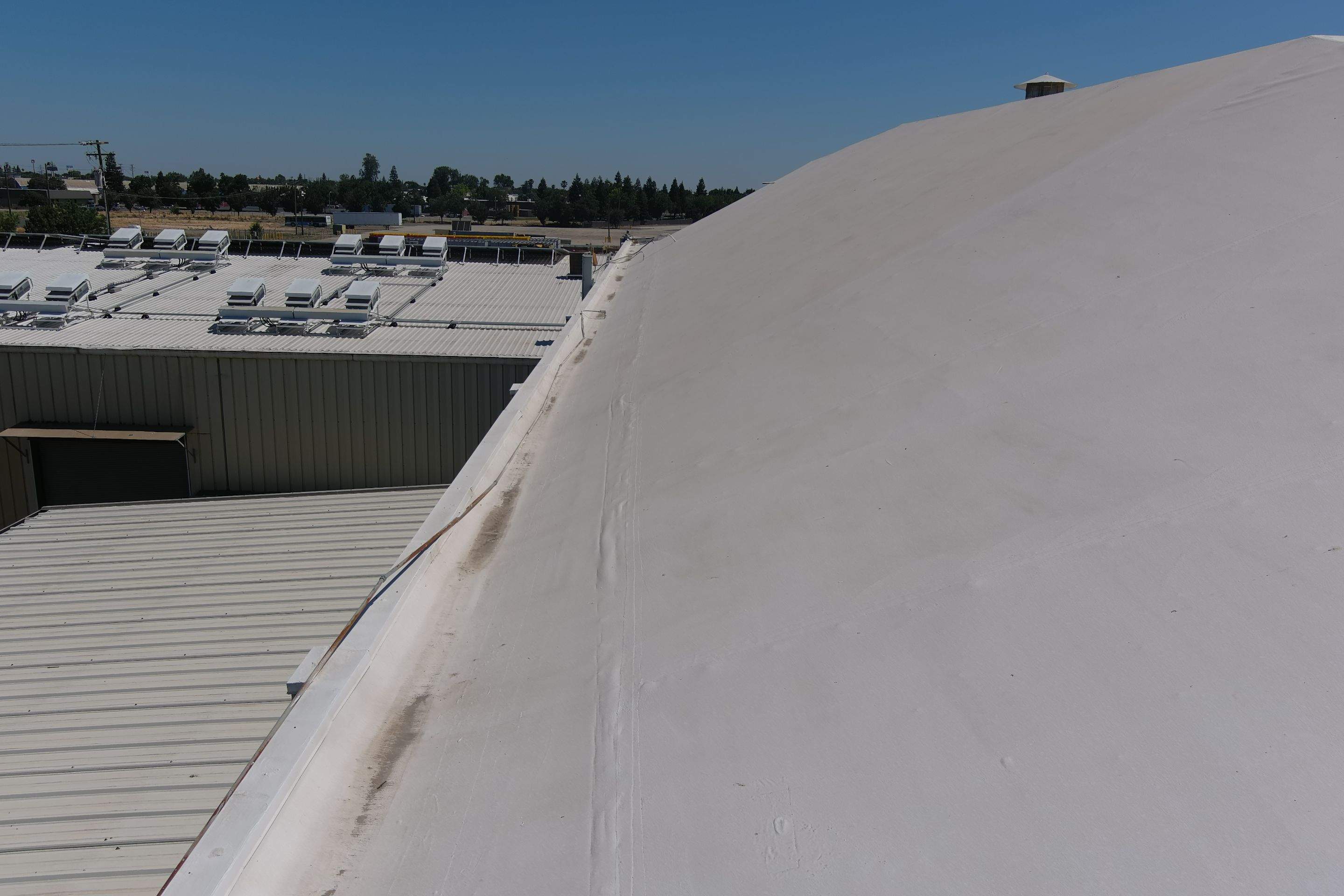 Single-ply restoration system using Conklin Benchmark/PUMA XL fabric and coating by Straight Edge Roofing Inc