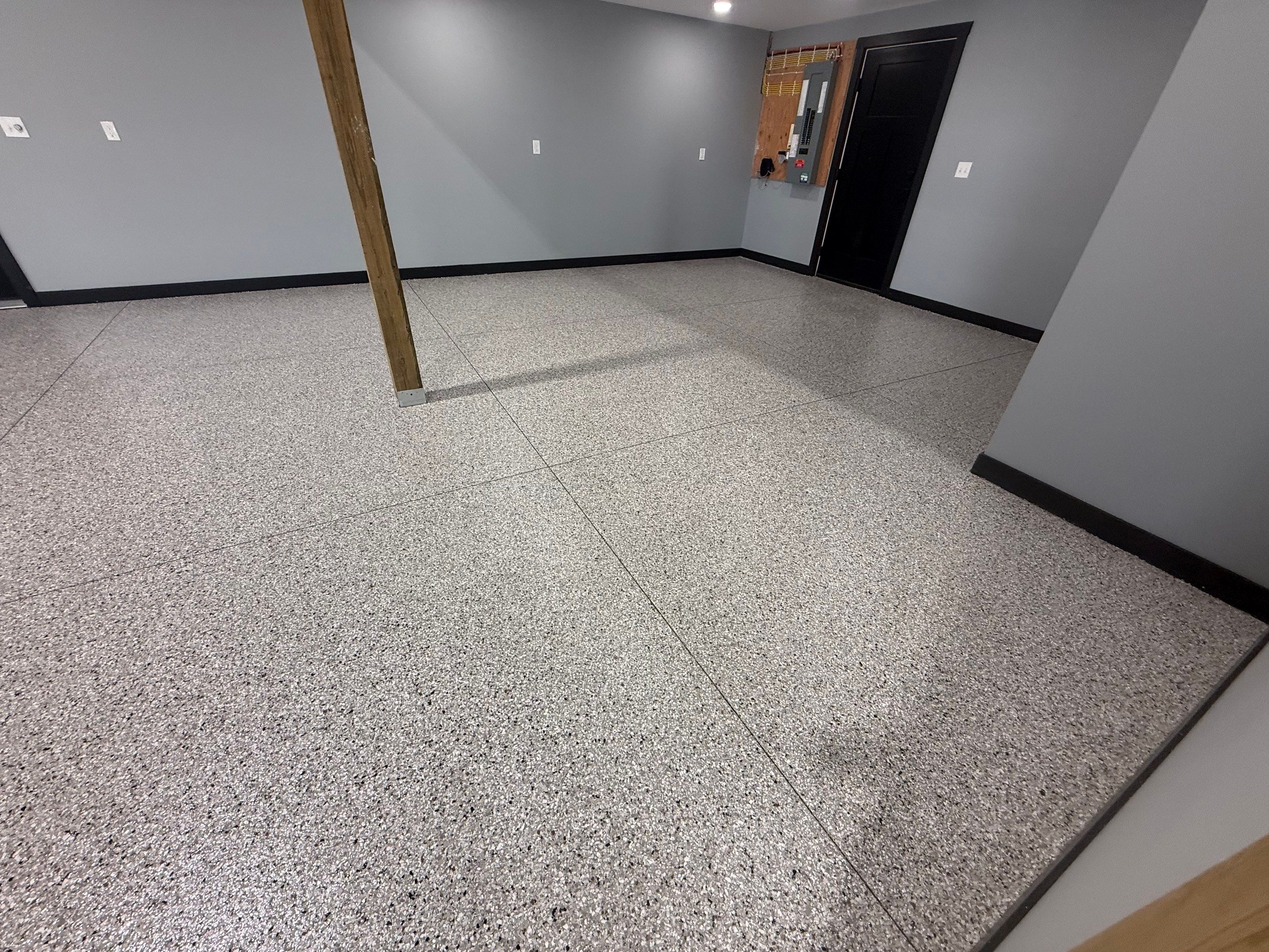 Polyaspartic Garage Floor Coating with Decorative Flake in Wentworth by Select Painting, Coatings & Garage Cabinets