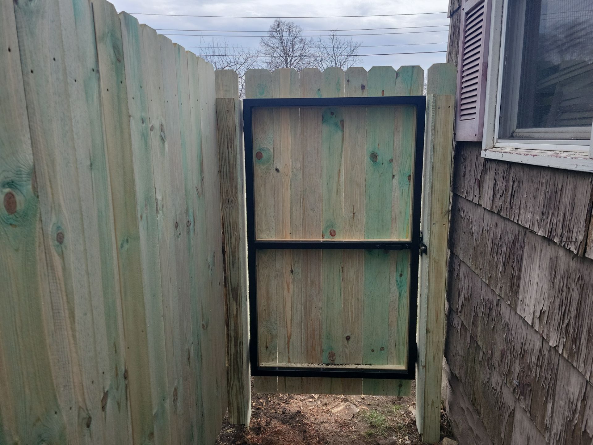 Custom Wood Privacy Fence and Gate Installation in Waterloo by Perfect Picket Fence and Stain