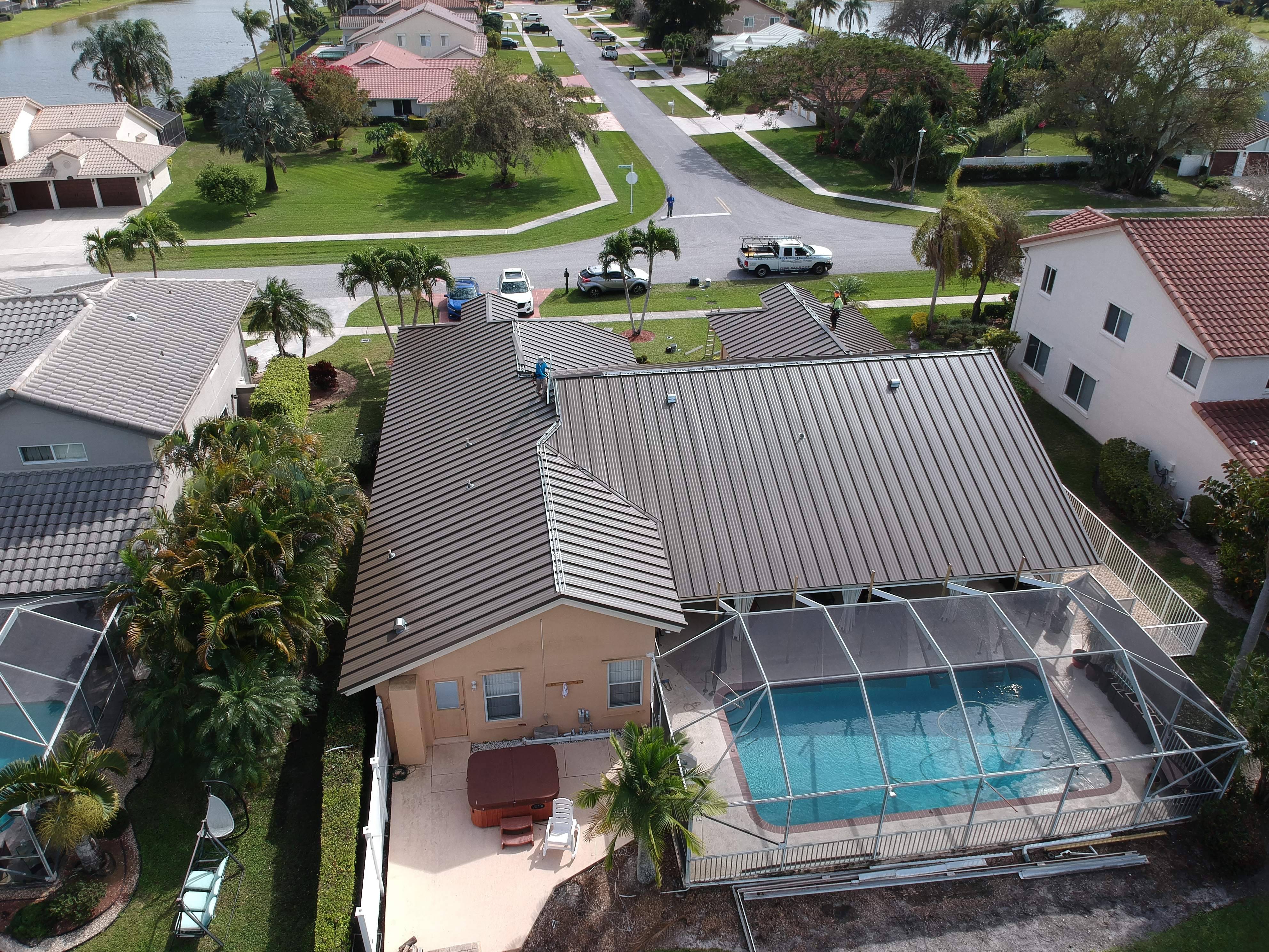Residential Roofing Installation using 1" Nail strip metal roof by BLUES BROTHERS CONSTRUCTION CORP