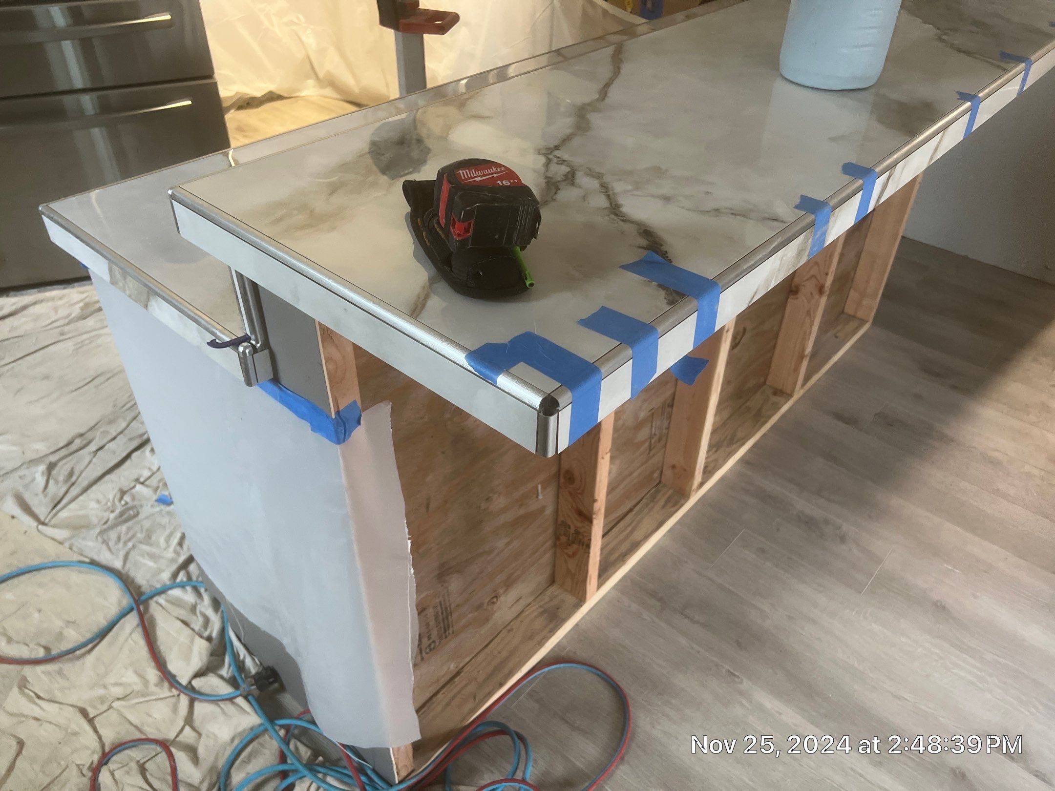 Marble Look Countertop and Stone Tile Backsplash Installation in Brookings by KMD Surfaces INC.