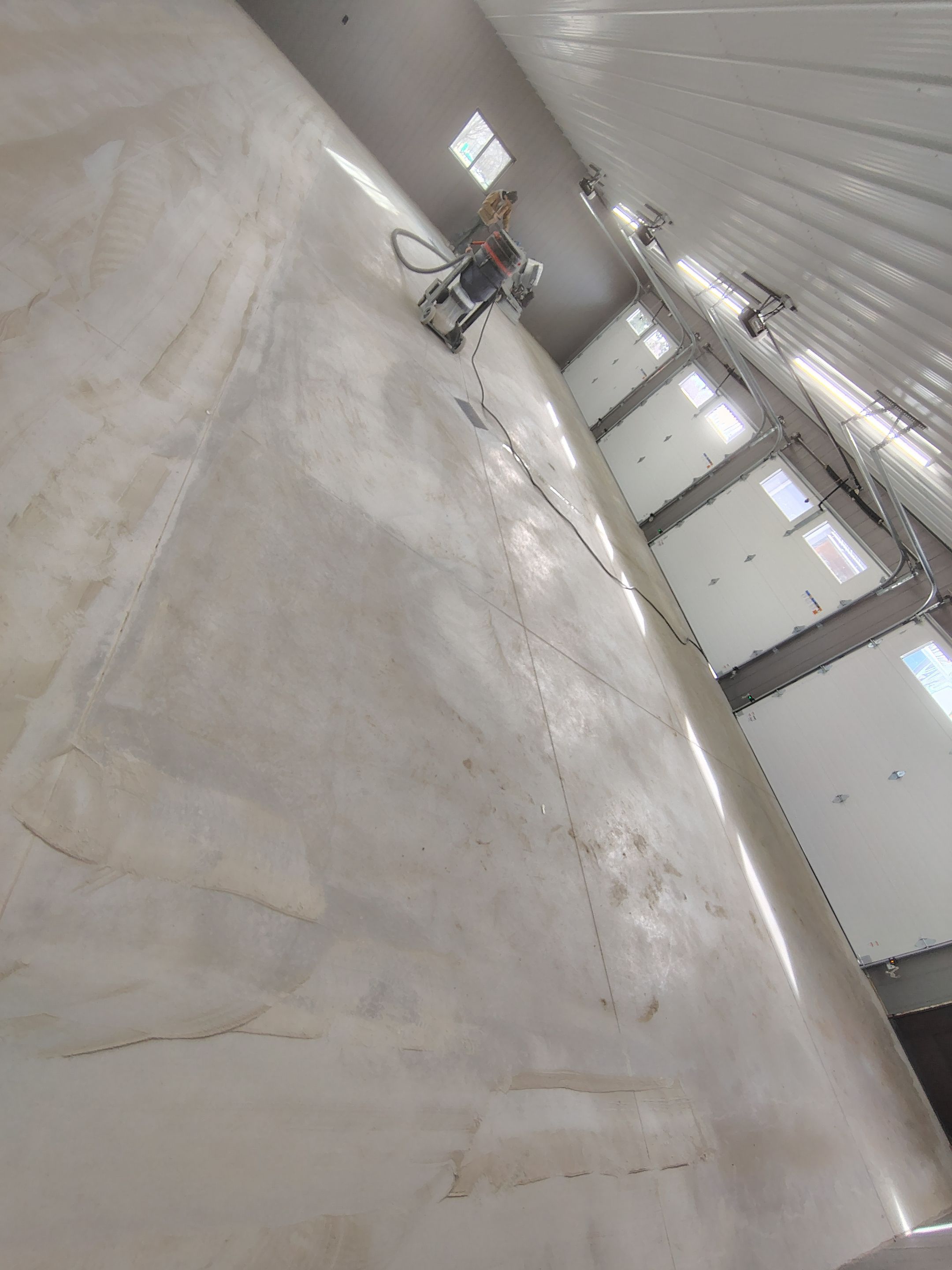 Speckled Epoxy Floor Coating for Large Shop in Rock Valley by Select Painting, Coatings & Garage Cabinets