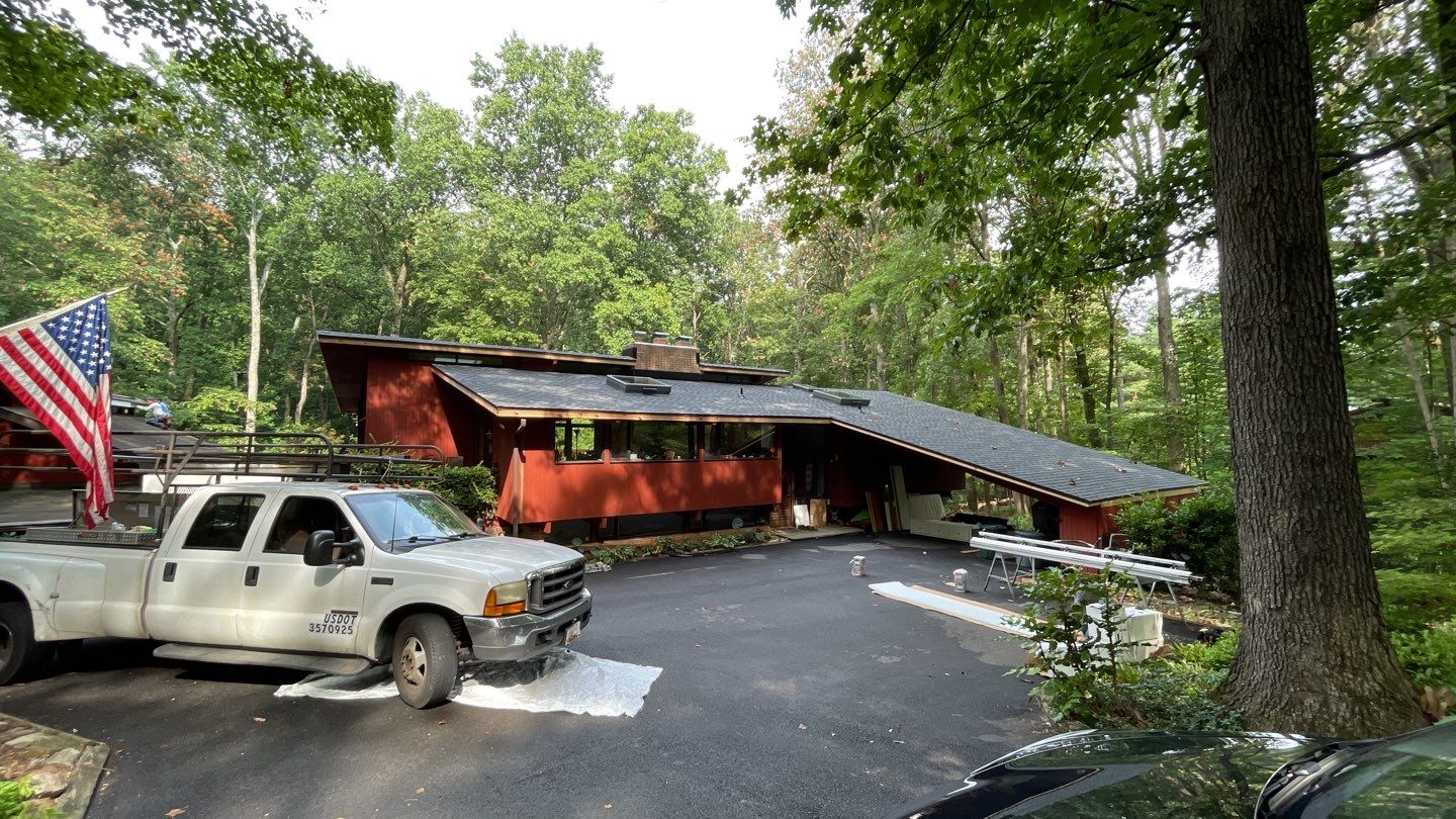 Deckhouse Roof Replacement by American Home Contractors