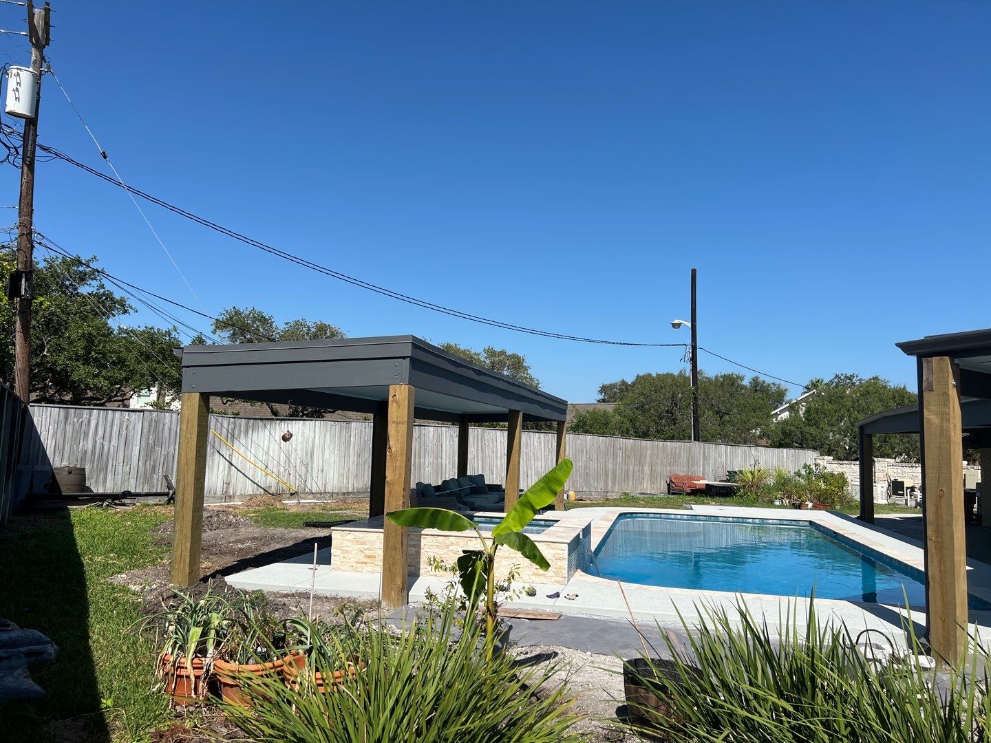 Beautiful pool side build by Bayfront Roofing and Construction