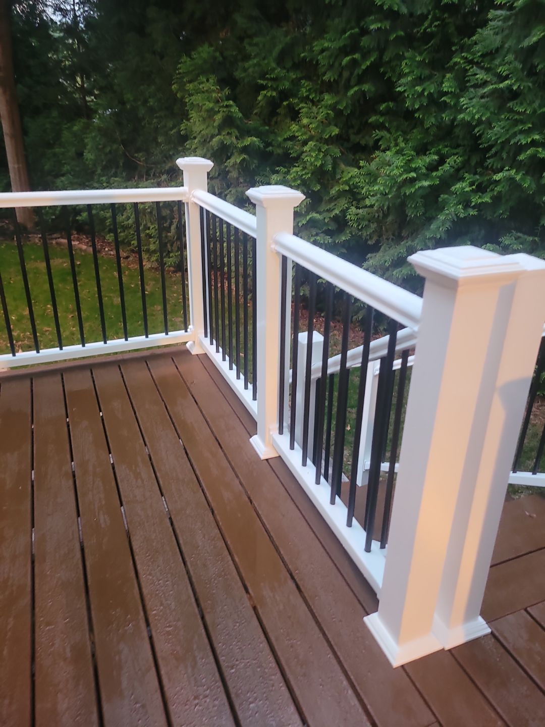 Fuquay-Varina Outdoor Upgrade – Composite Deck & Paved Landing by Elite Remodeling and Design LLC