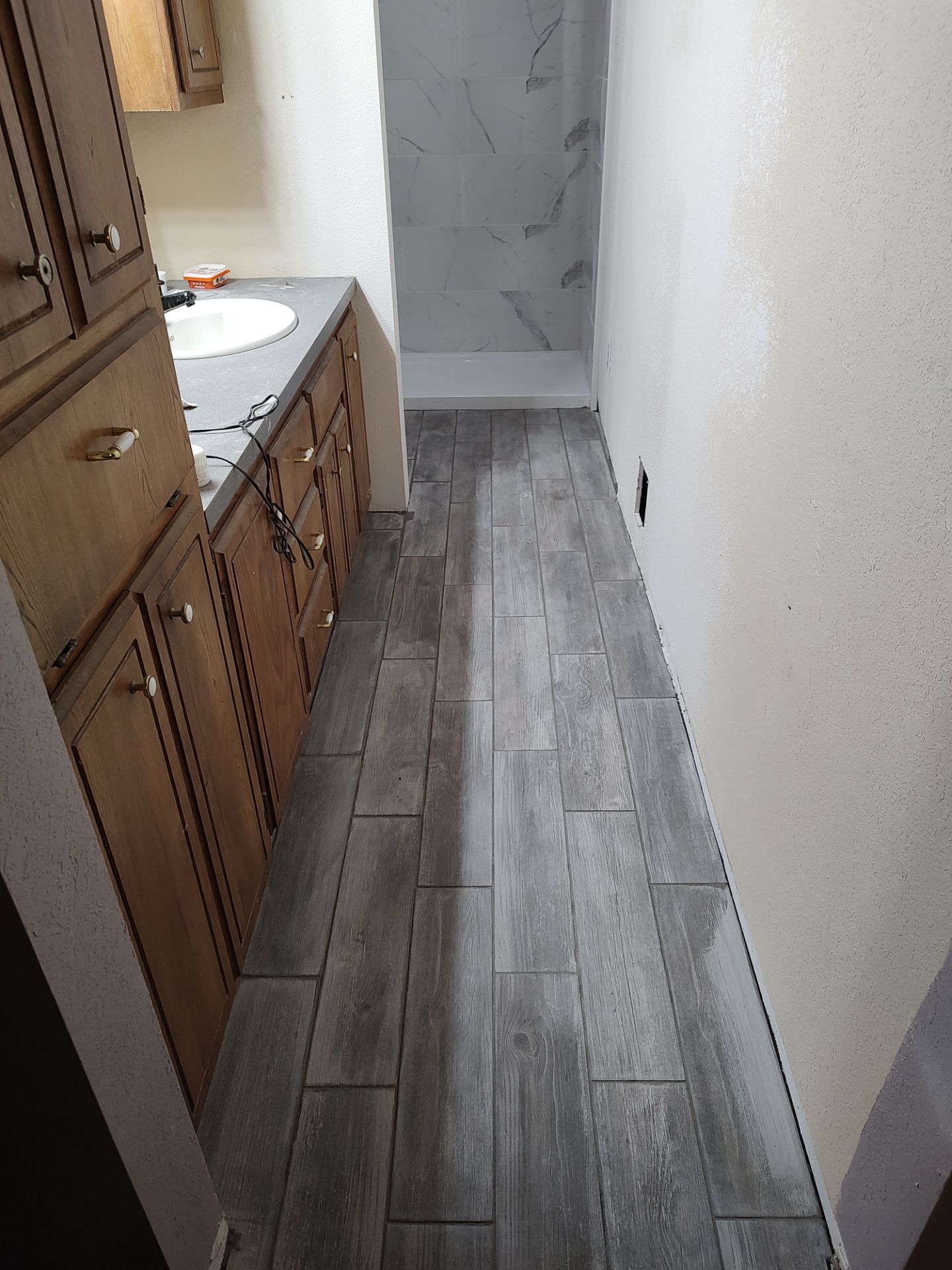 Bathroom remodel w/shower upgrade by In & Out Construction & Remodeling, LLC