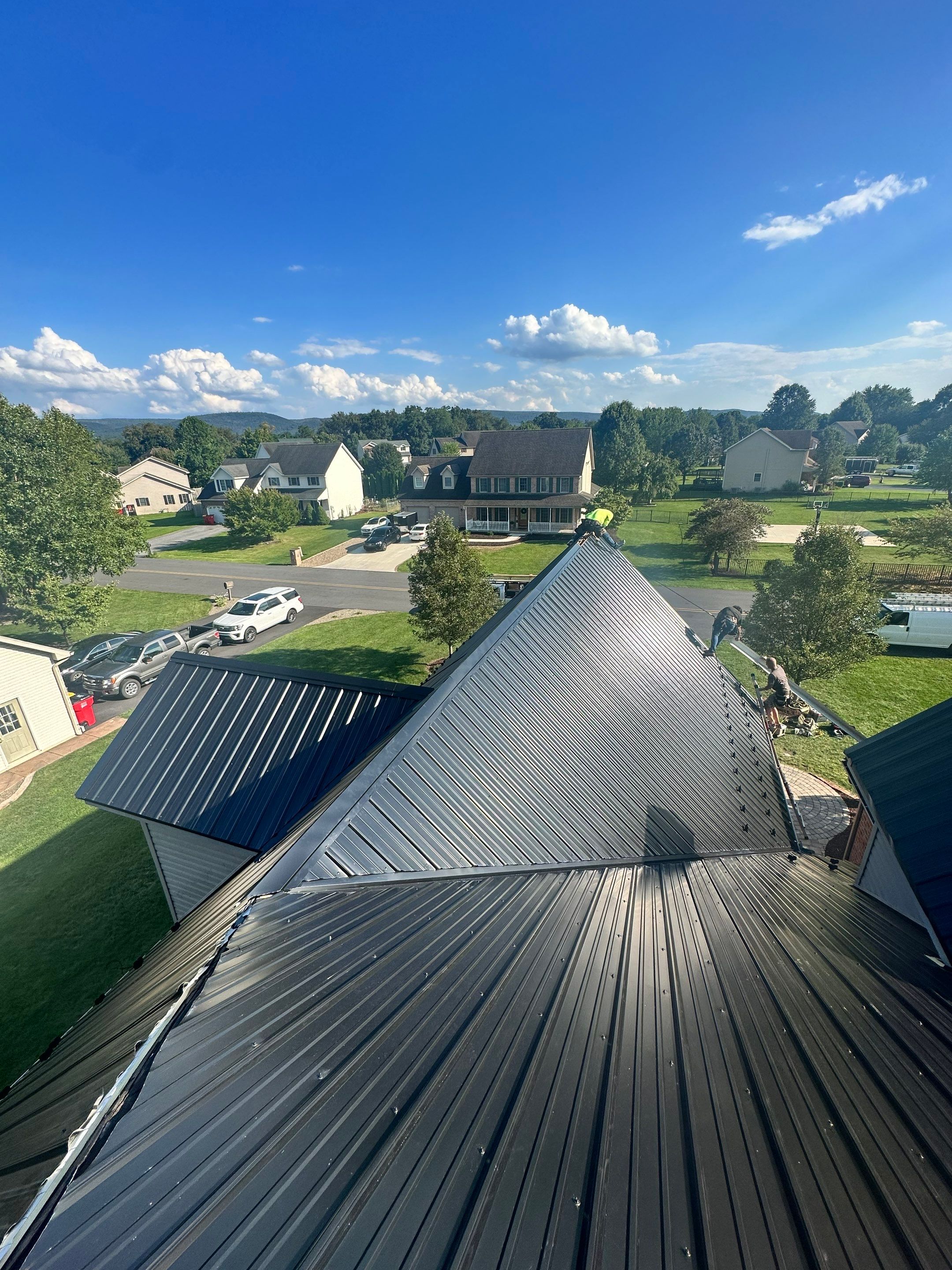 Standing seam / Azm panel in black  by Teflon Roofing