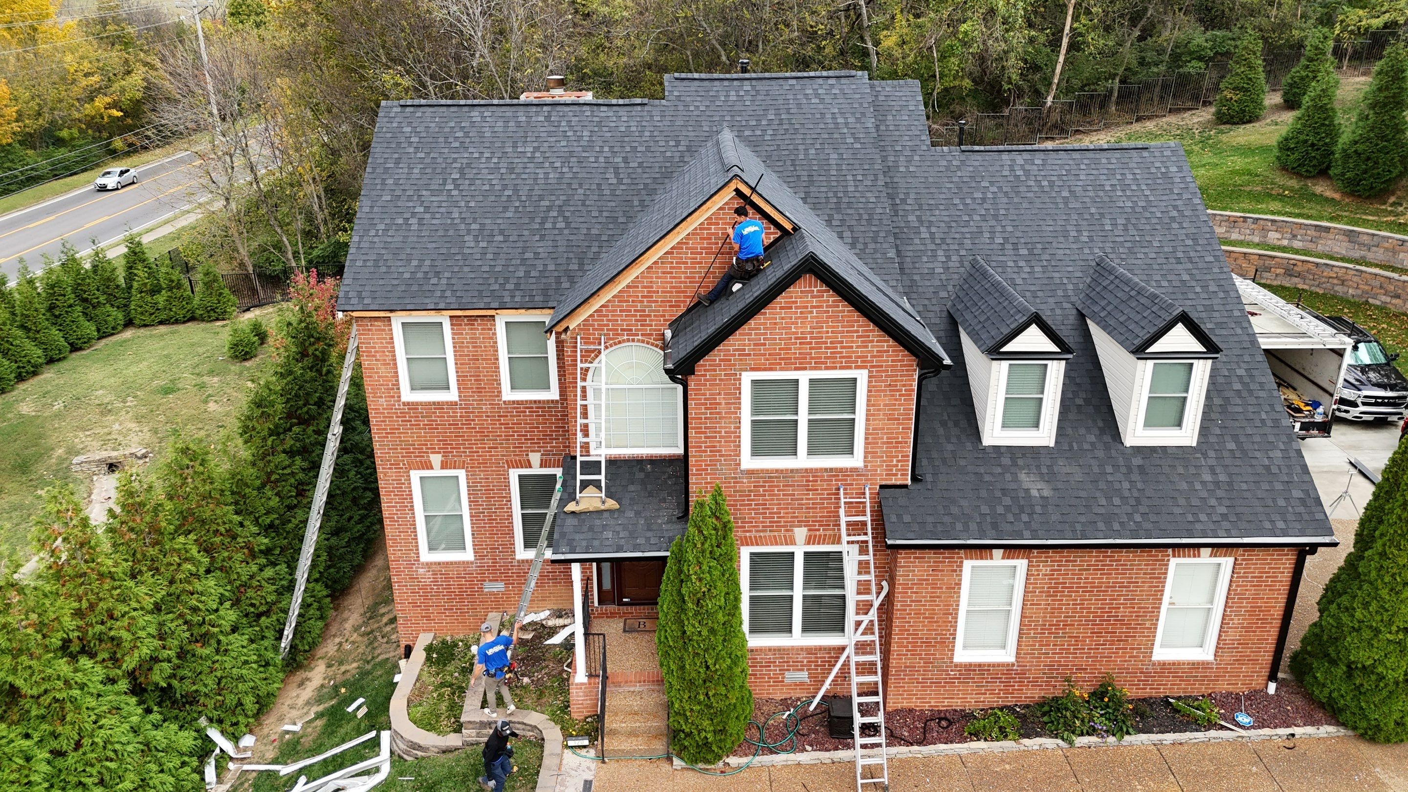 Charcoal Black Re-Roof & Gutters by Royal House LLC
