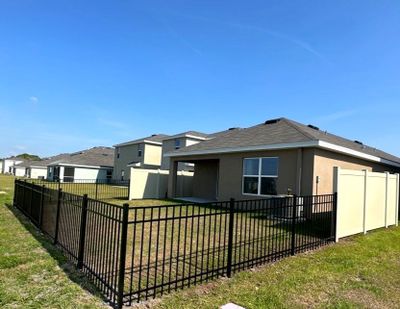 Aluminum Fence Installation using Vinyl Fence and Black 3 Rail Aluminum Fence 