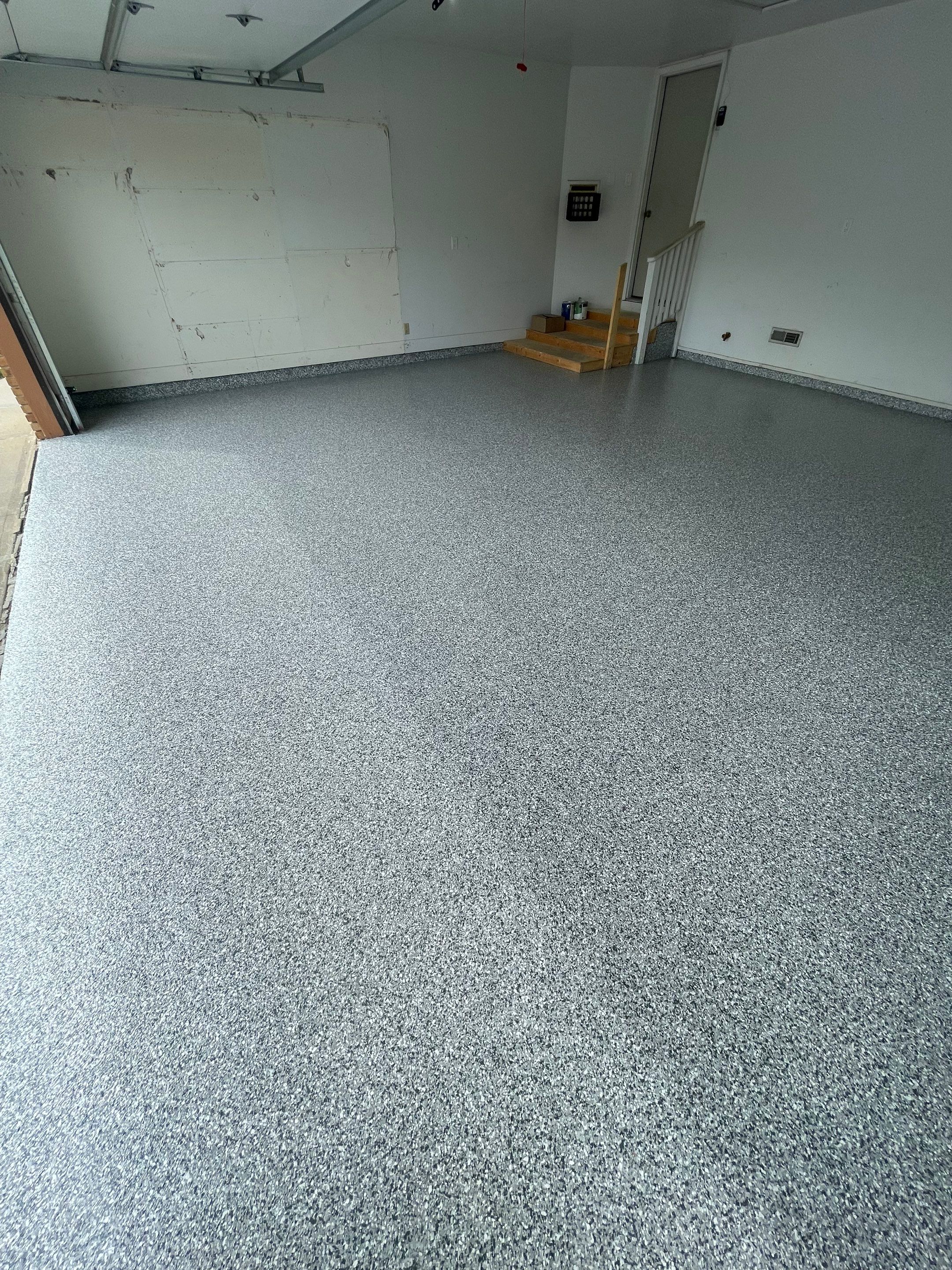 Grey Speckled Concrete Coating for Residential Garage in Yankton by Select Painting, Coatings & Garage Cabinets