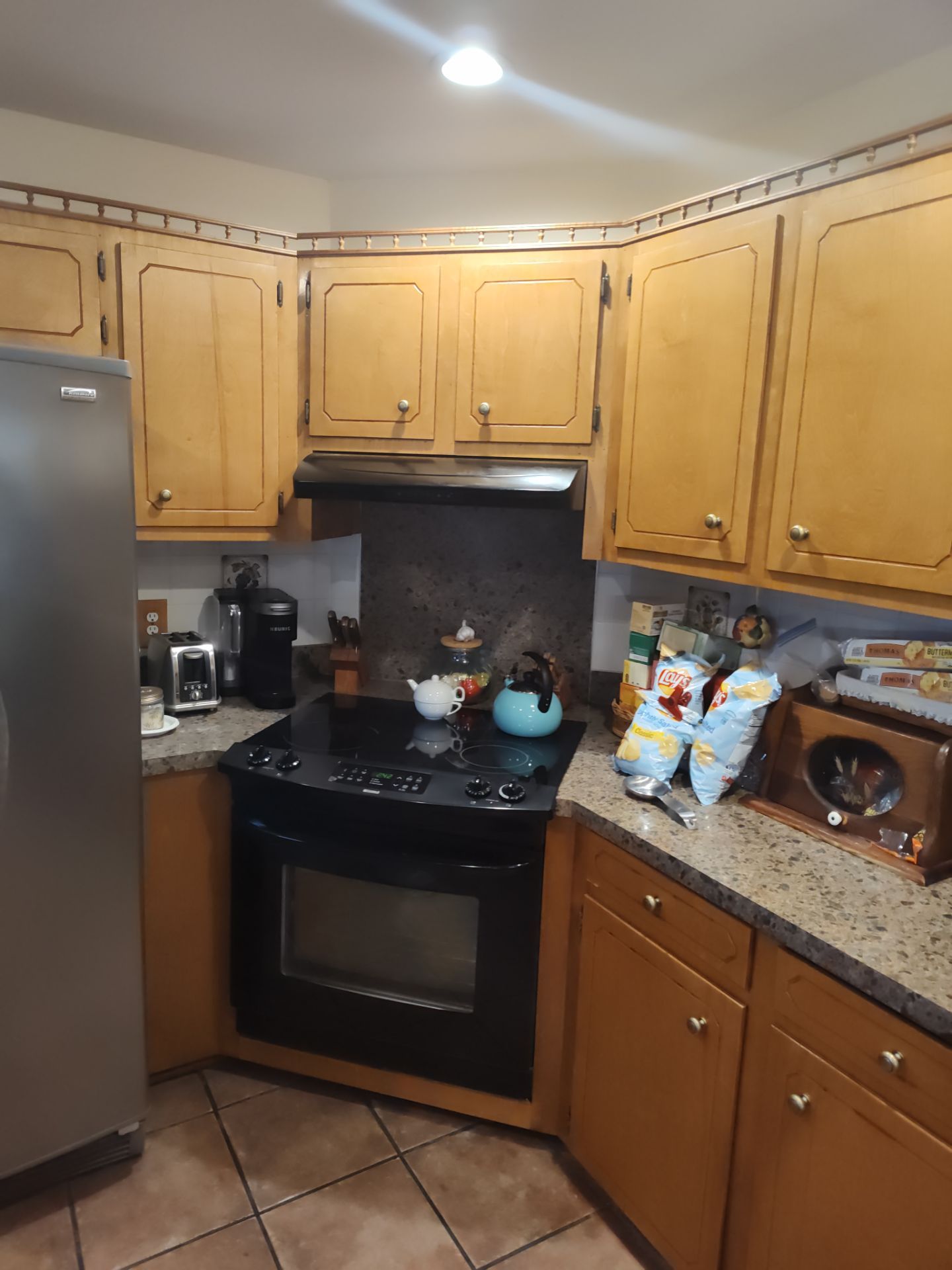 Remodel Kitchen refinishing cabinets by Cornerstone Home Builders, LLC
