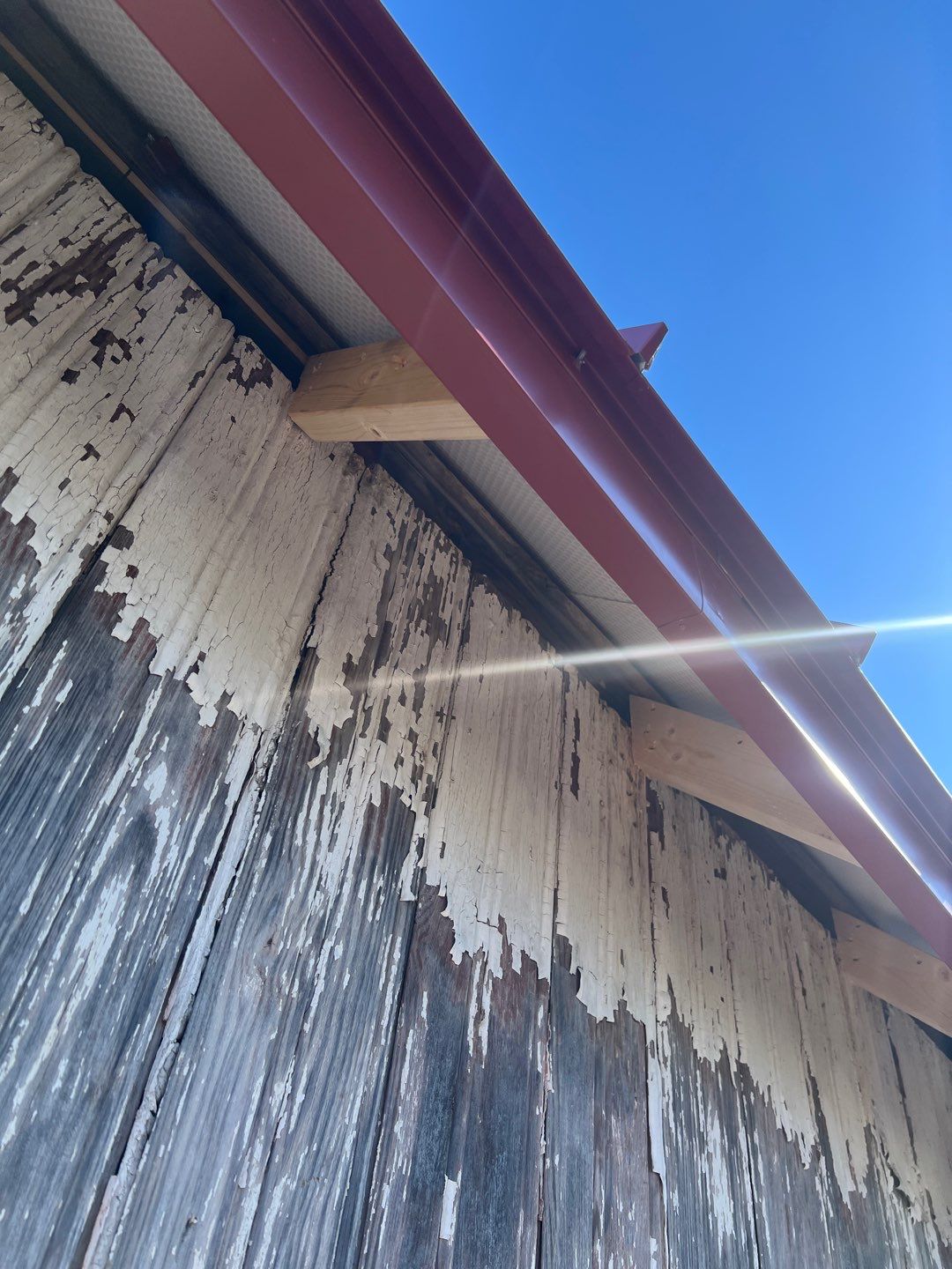 Residential Roofing Installation using Standing Seam Metal - Barn Red by RoofX 