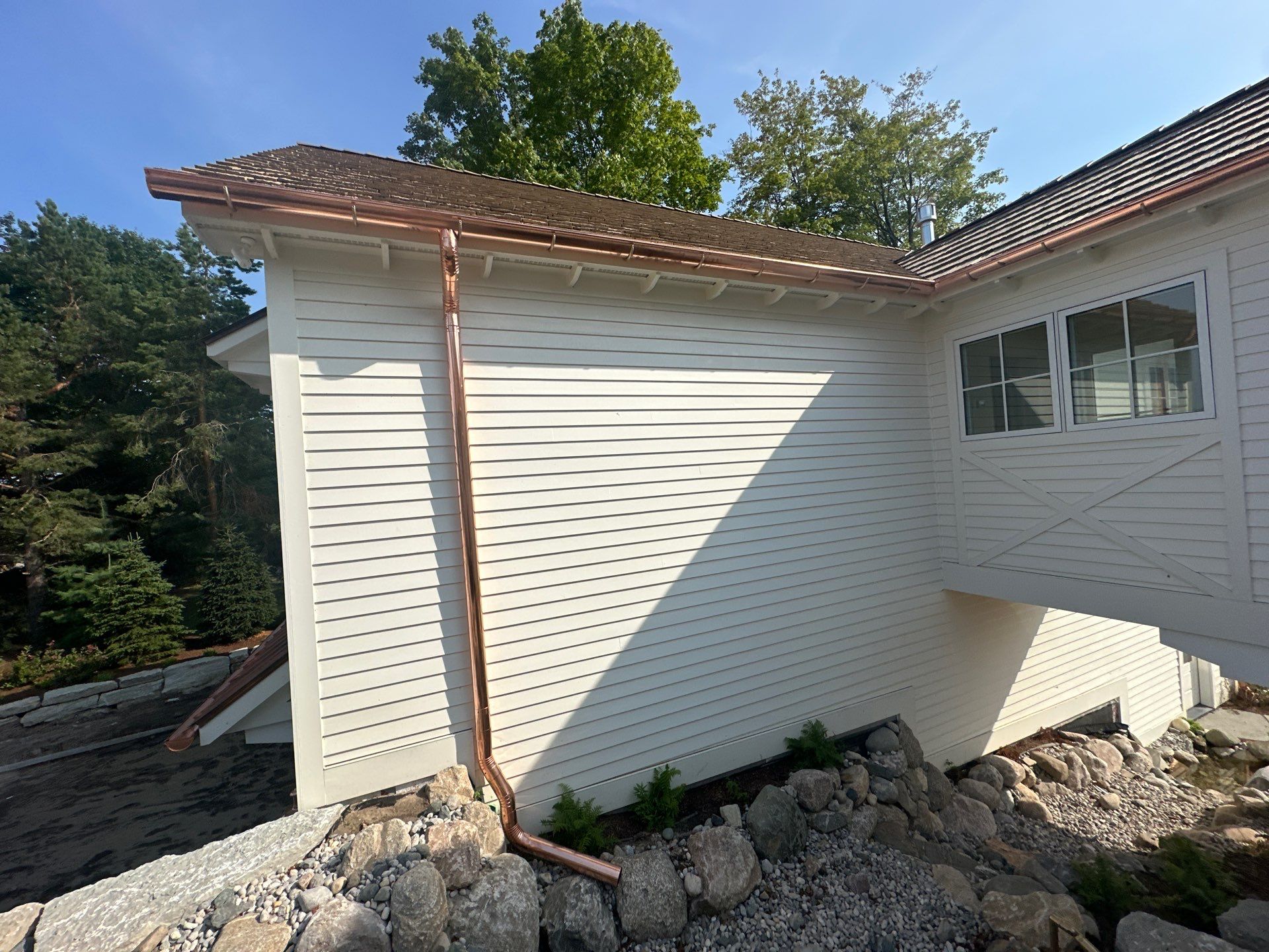 Custom Copper Gutter System and Accent Roofing in East Jordan by Rainbow Seamless Systems
