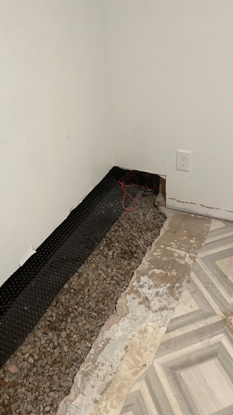 Interior Drain Tile & Buried Discharge in St. Anthony, MN by Waterproofing Northeast